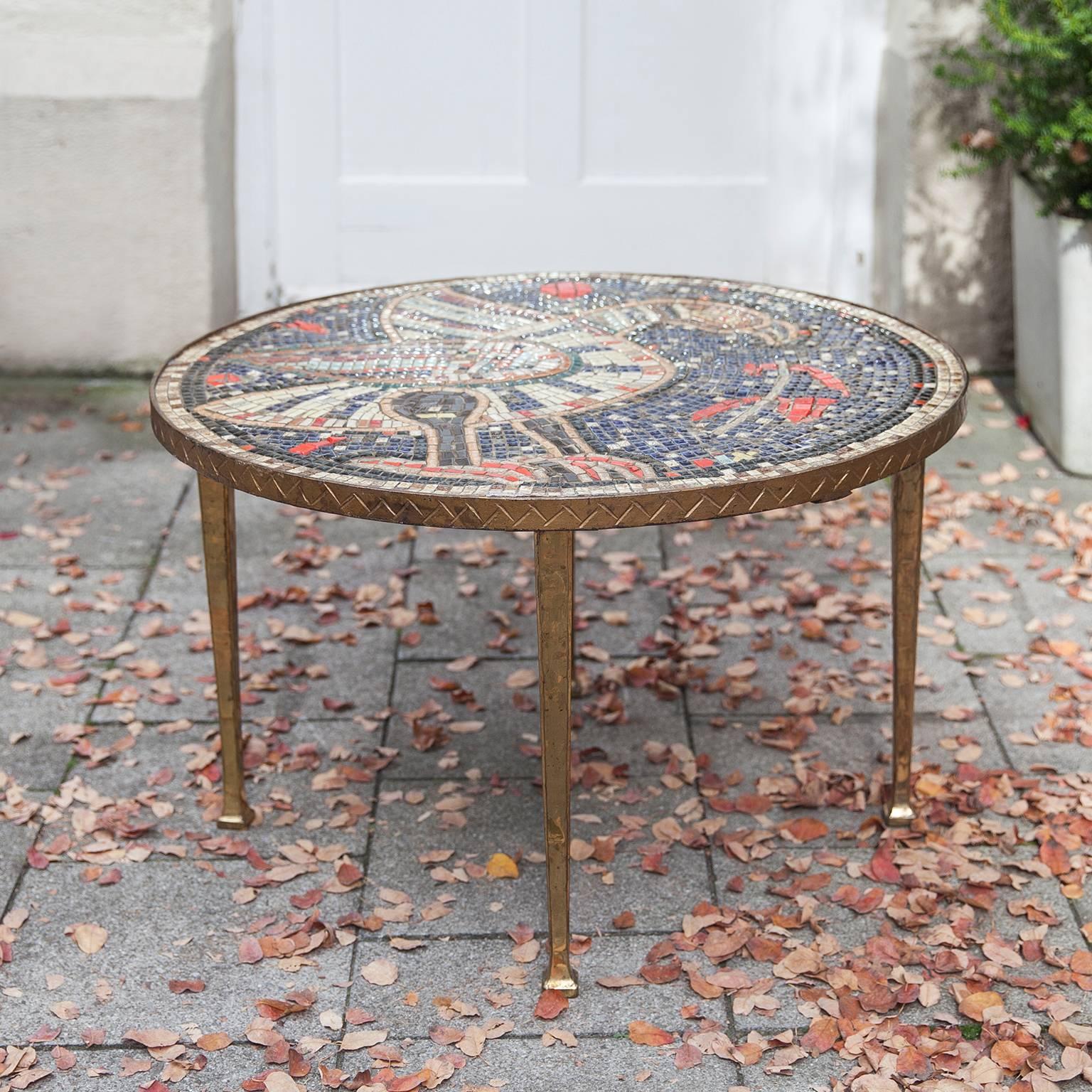 Wonderful Art Deco round mosaic table with golden bronze legs and a fantastic roman antic bird motif.
Measures: H 51 x D 81 cm.