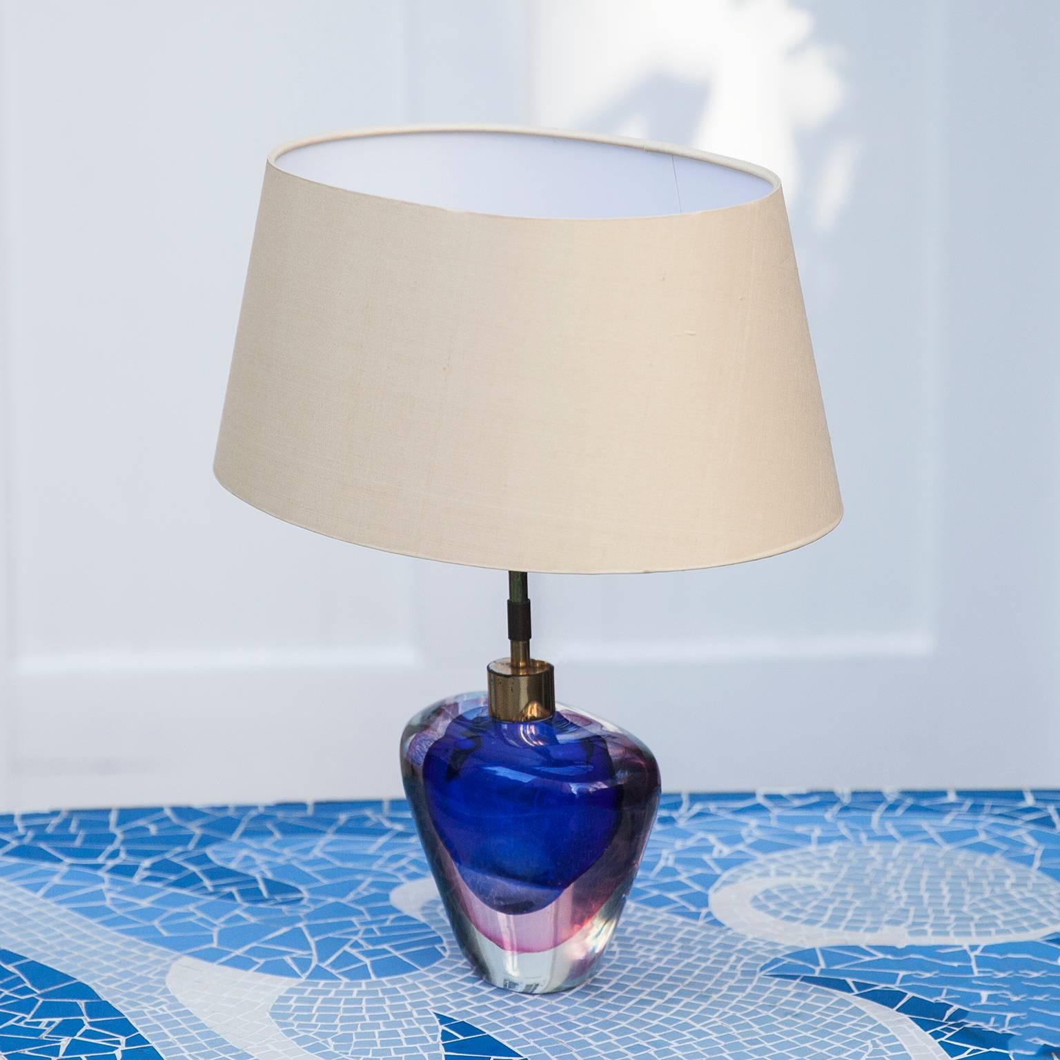 Very elegant table lamp by Flavio Poli for Seguso Murano Italy, very heavy
blown Murano glass in fantastic blue and pink color, oval wild silk shade.
Measures: D 26 x B 36 x H 42 cm.