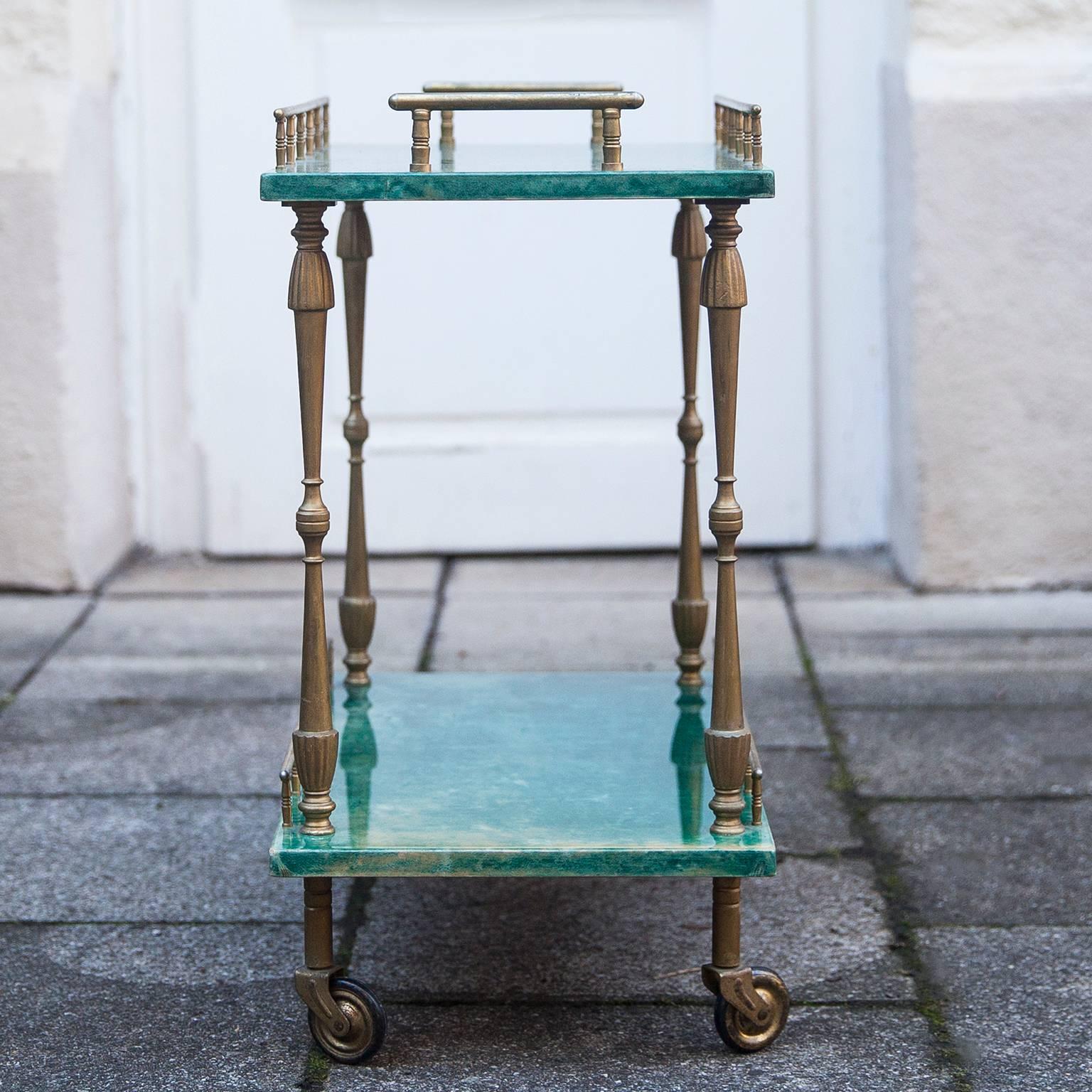Wonderful small bar cart in deep green goatskin made by Aldo Tura, Italy, 1960s.

Measures: H 50 x W 50.5 x D 28 cm.
