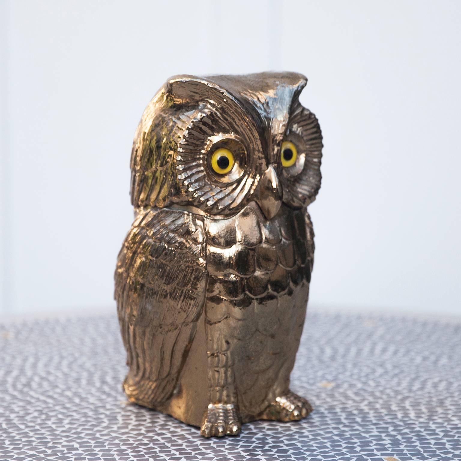 Beautiful gold colored Freddo Therm ice bucket in design of an owl with glass eyes from Switzerland, 1970s.
 