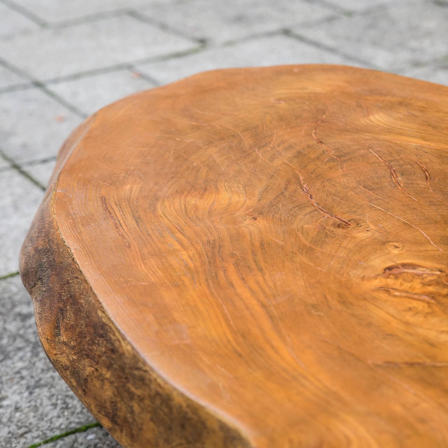 Very elegant tripod tree trunk table, with fine brass feets, probably France 1960. Excellent condition.