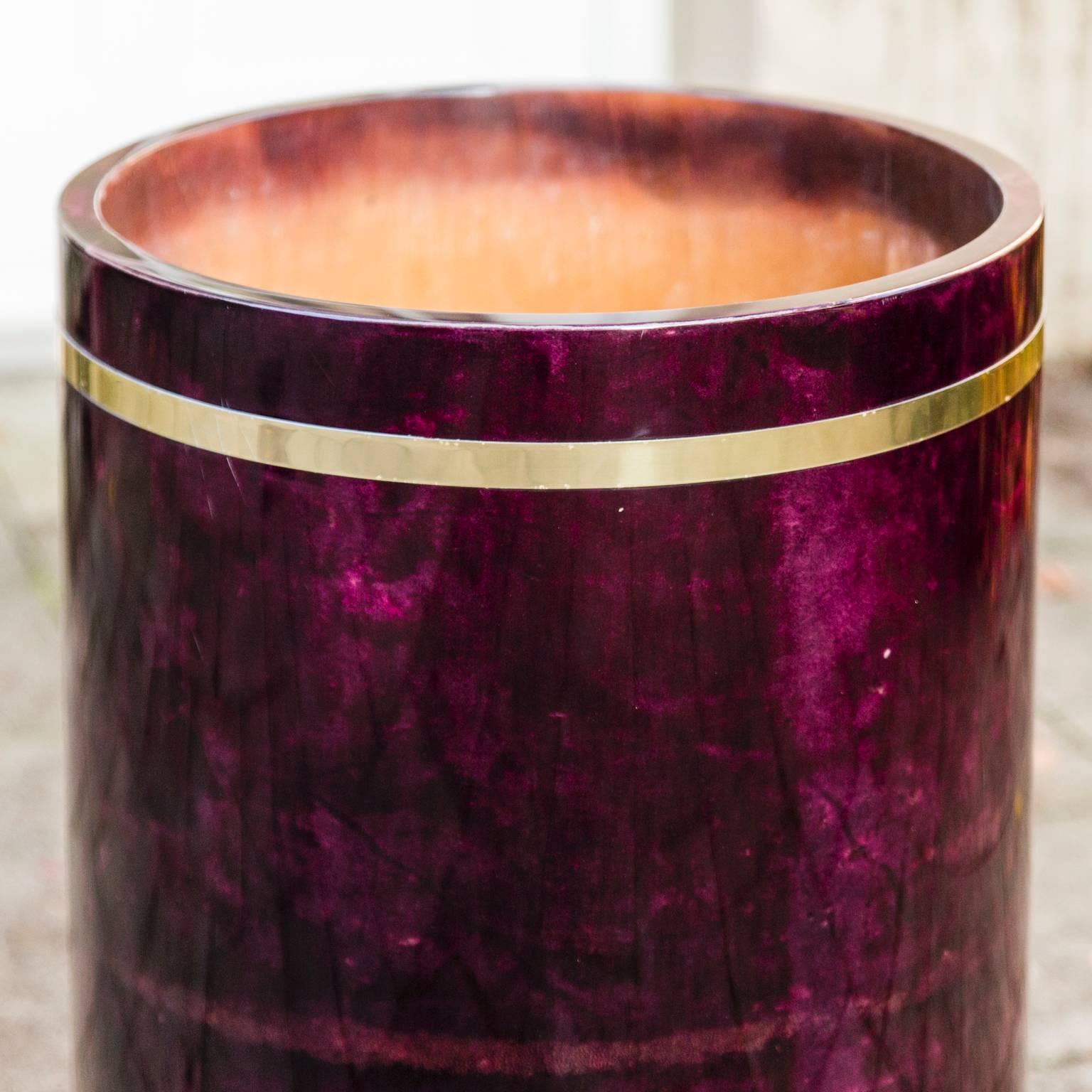 Round planter in purple by Aldo Tura, Italy. With golden ornament.