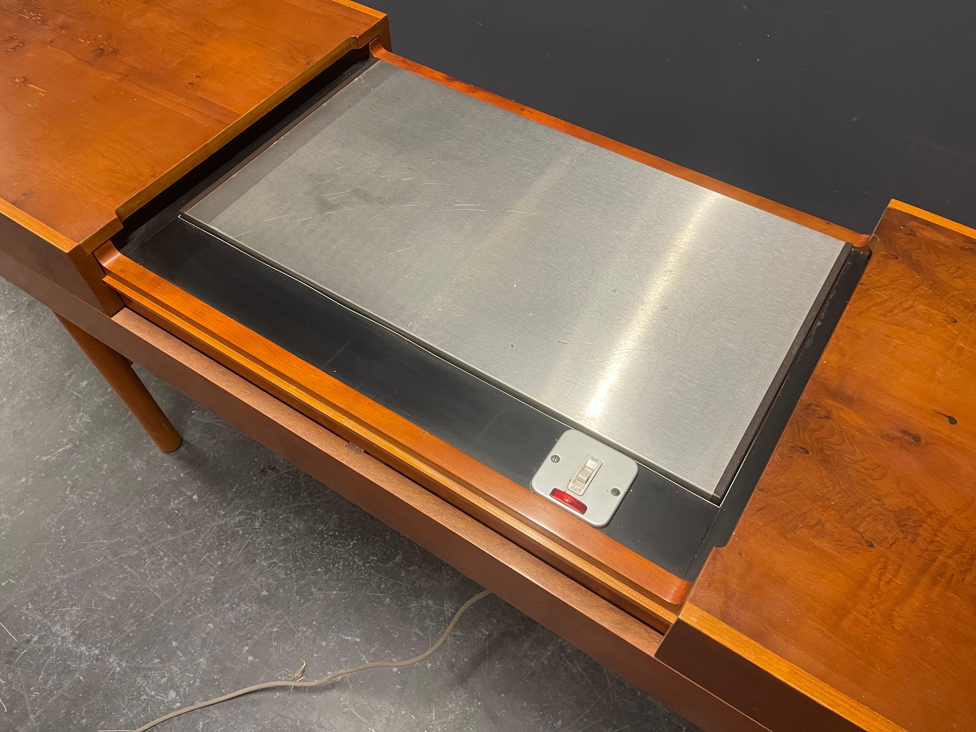 Designed by Robert Heritage and made for Heal's. Part of the Granville range. Amazing piece of furniture, four drawers for cutlery and a heating plate inside.
(Not tested - as it uses 110v).