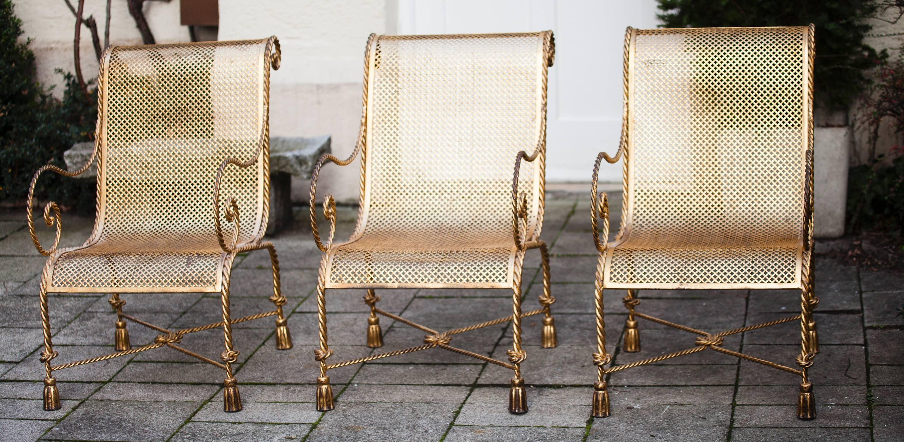 Three of very well-made and elegant Classic 1950s Italian armchairs with heavy frames made in the form of twisted rope with tassel front feet. They can be also used as garen chairs.