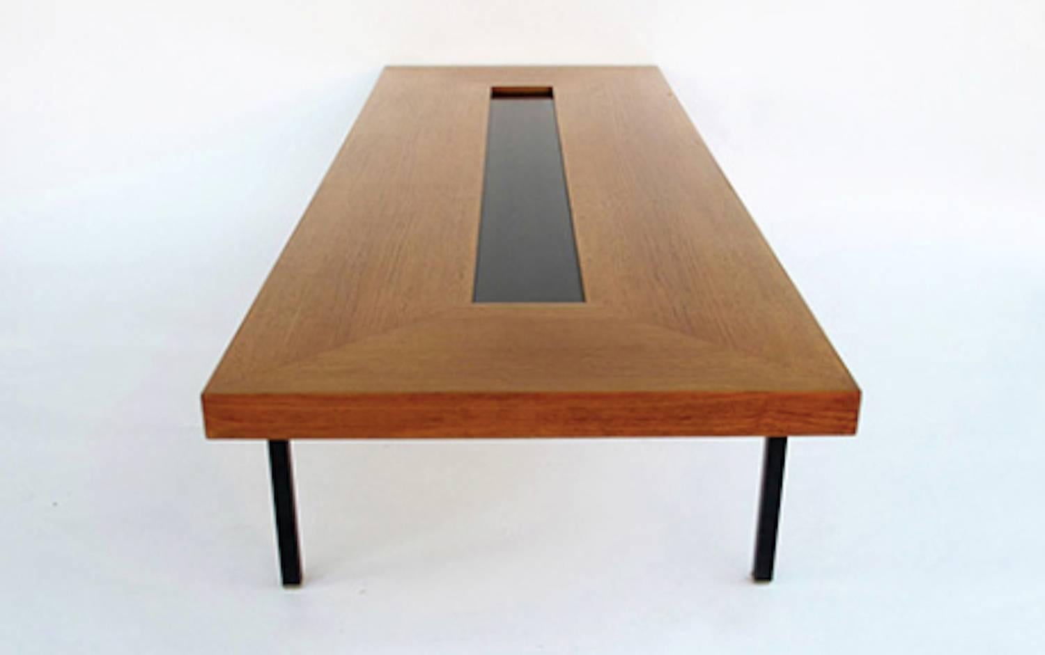 Wonderful and very rare extra large coffee table by Antoine Philippon and Jacqueline Lecoq. Black laquered steel legs and teakwood top with black laquered inlay.

LOCATED IN HAMBURG