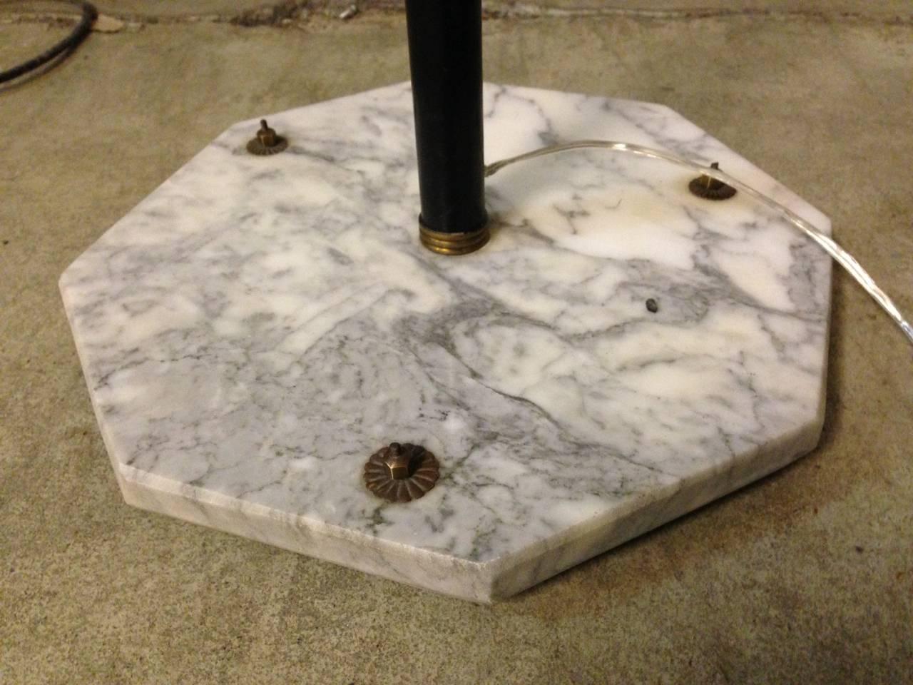 Marble base, brass details and white glass shades.