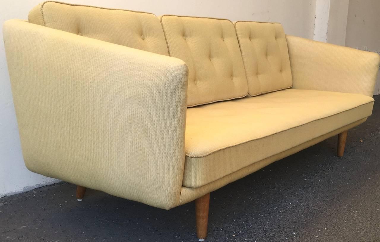 Designed in 1955 and made by Fredericia. Upholstered with wonderful original fabric. Three reversible back cushions. All cushions have sprung like a mattress.