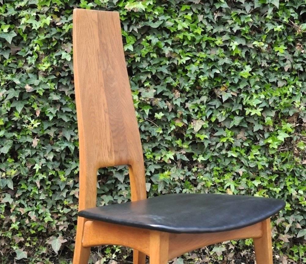 Set of four dining chairs by Ernst Martin Dettinger, massive oak.