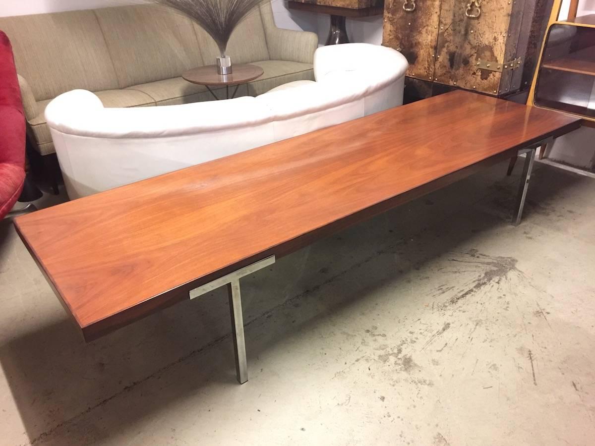 Huge walnut top and chromed steel base.