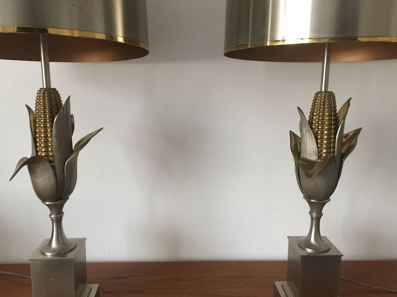 Beautiful pair of lamps in steel and brass. Very good condition with original metal shades and both signed.