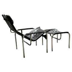 SILLÓN DE SALÓN HANS EICHENBERGER PARA STRÄSSLE CON TABURETE DE CUERO TUBO DE ACERO, años 60