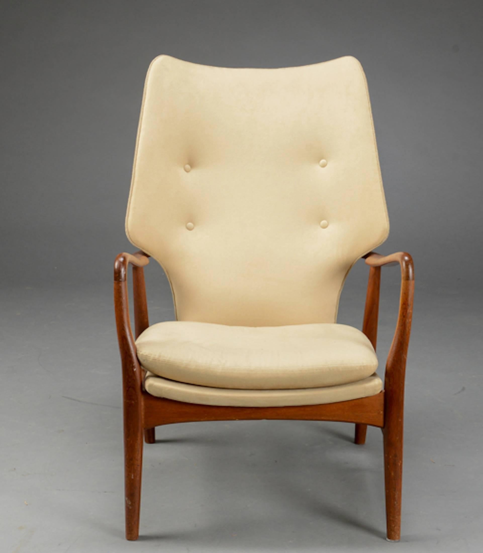 A high-backed Danish armchair designed by Madsen and Shübel .  Teak frame, back, seat and seat cushion upholstered in Alcantara . Excellent condition.