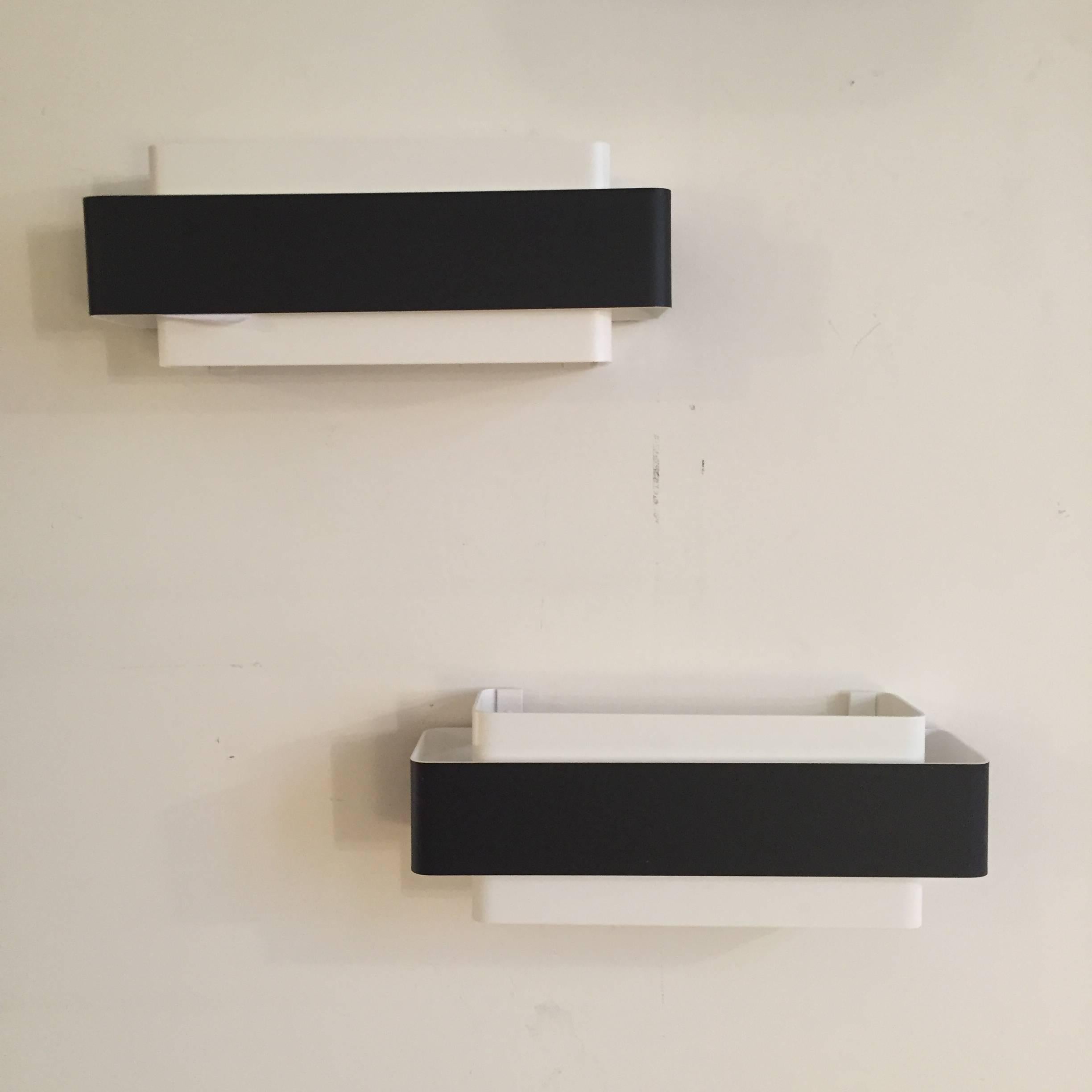 A pair of French XX Century sconces, Black and white enameled metal. Excellent condition.