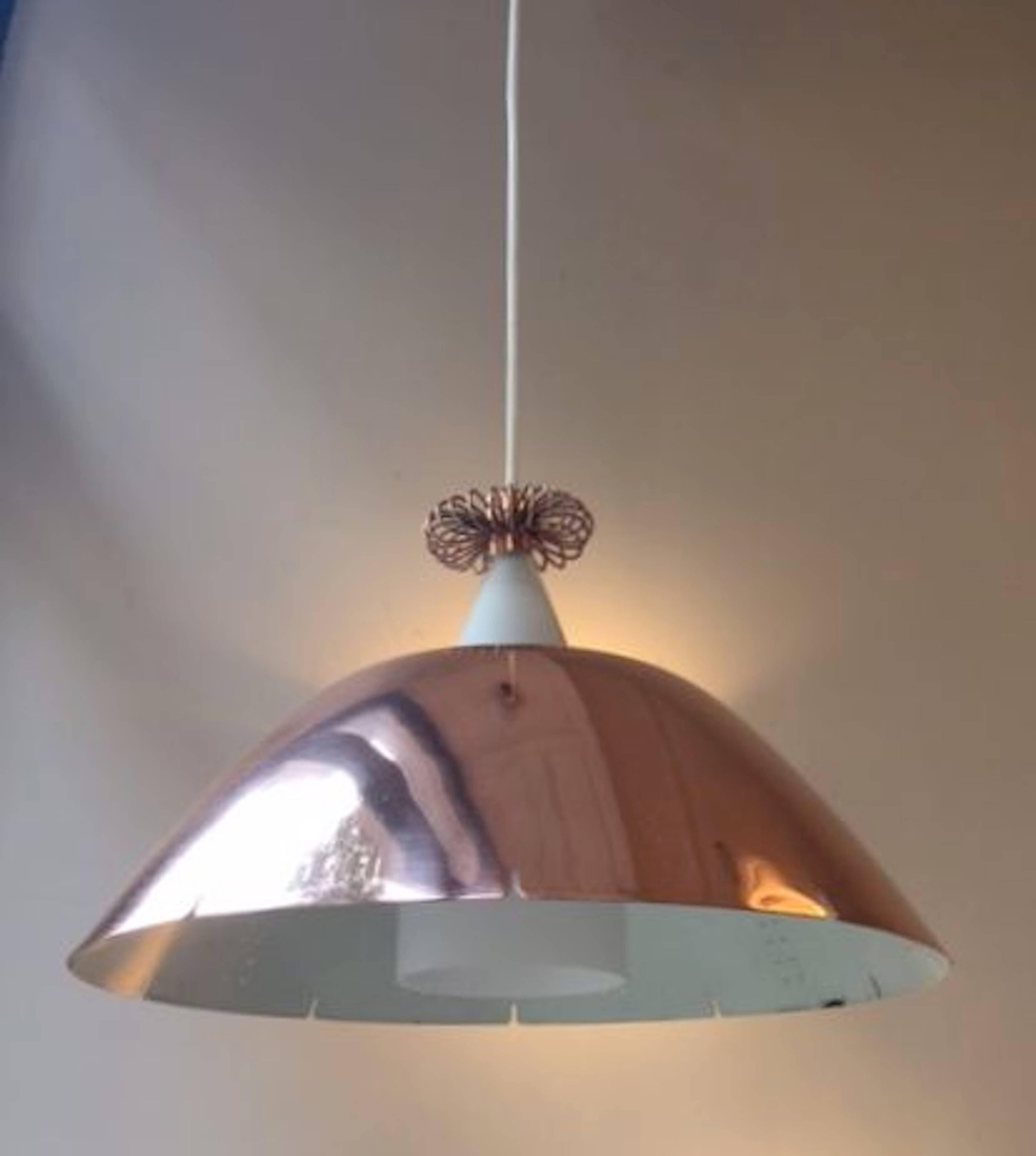 An fully original 1950 copper pendant by Paavo Tynell. Perforated copper shade. Perfect condition.
Shipping to USA €:220.
    