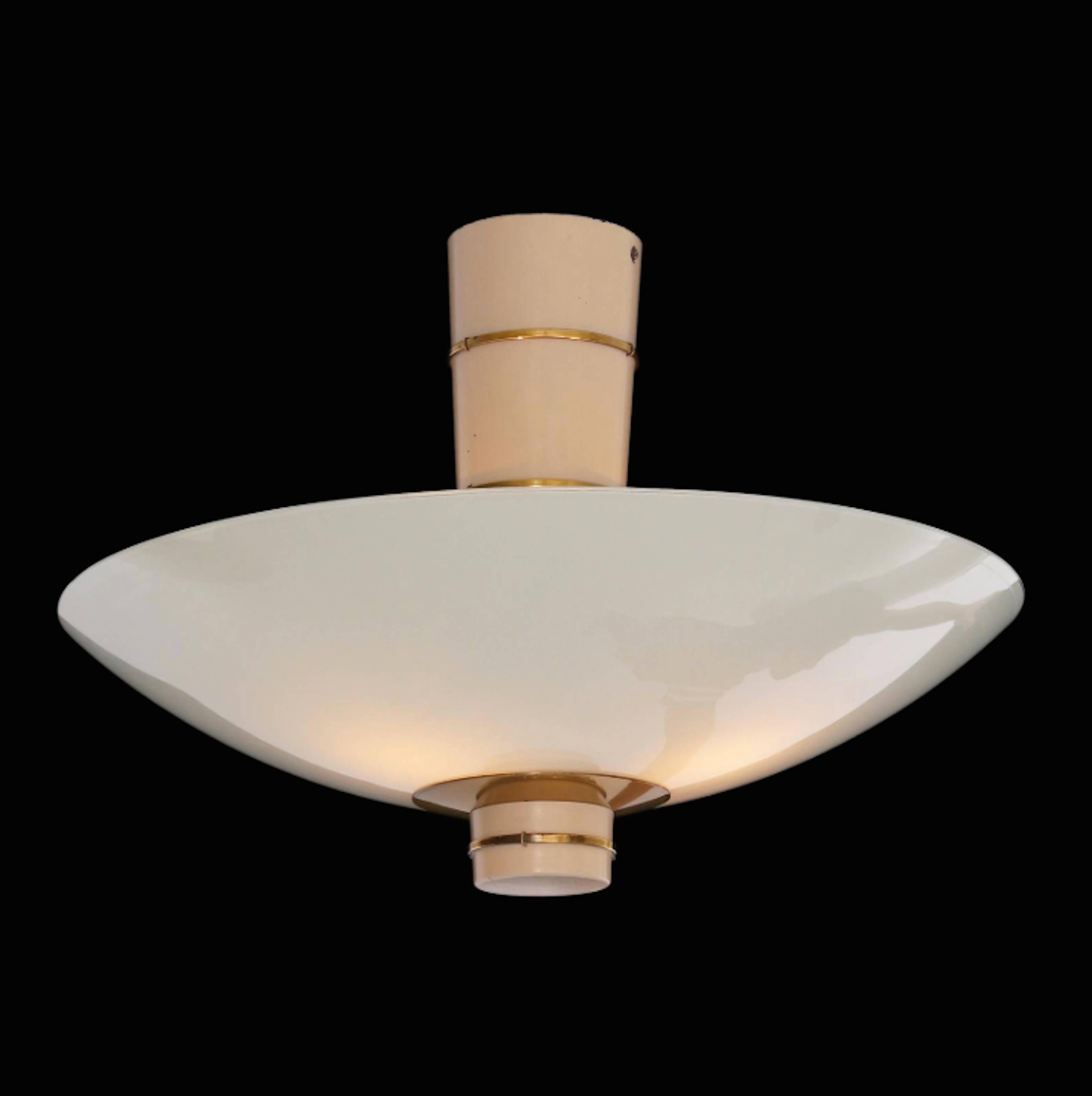 A Paavo Tynell ceiling lamp edited by Taito Oy in 1940. .
White painted metal, brass and opaline glass . Signed Taito.9055. Perfect condition.
Literature: 