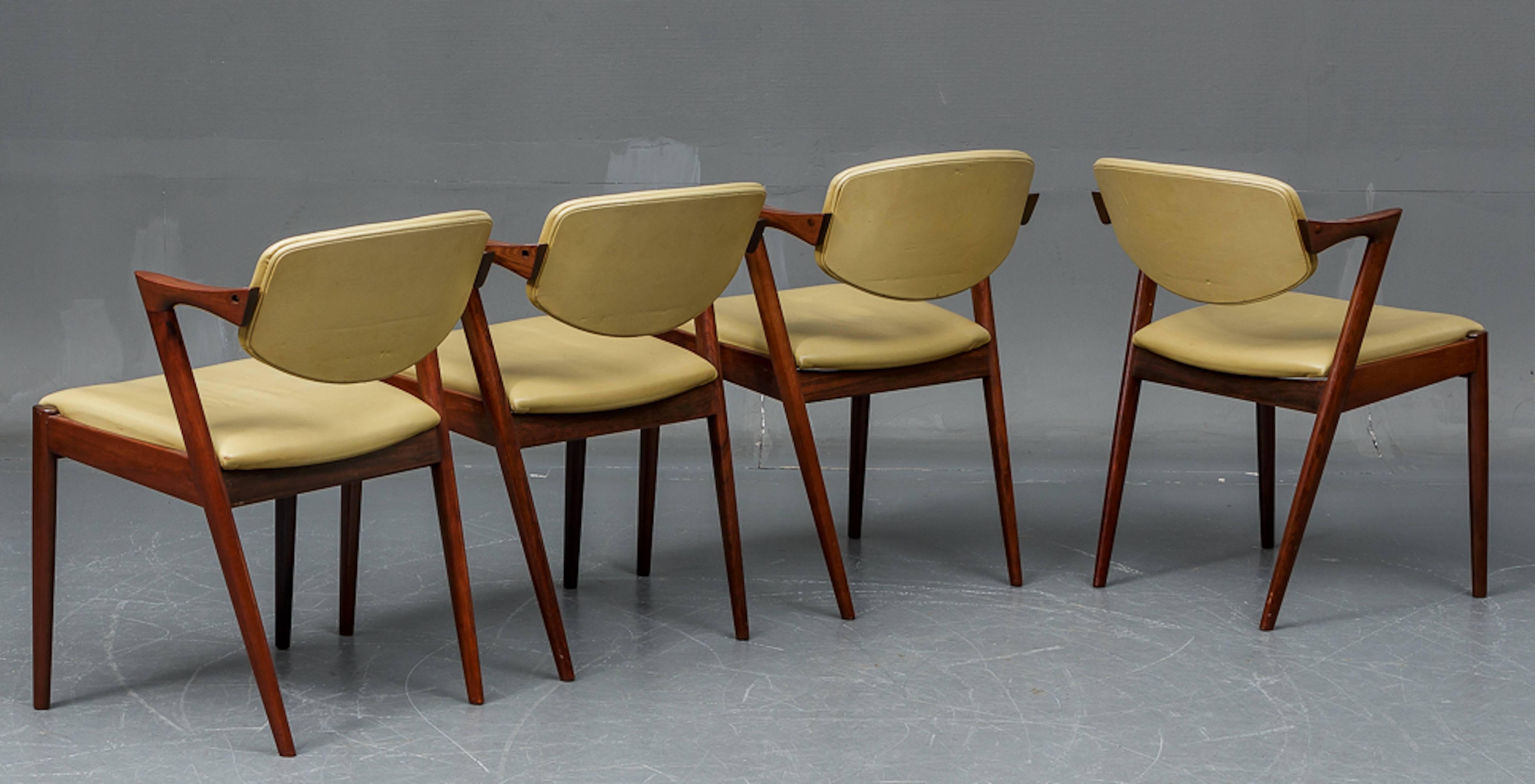 Four Kai Kristiansen rosewood dining chairs. Model 42. Rosewood framework , seats and back upholstered in original light green leather.Excellent condition .