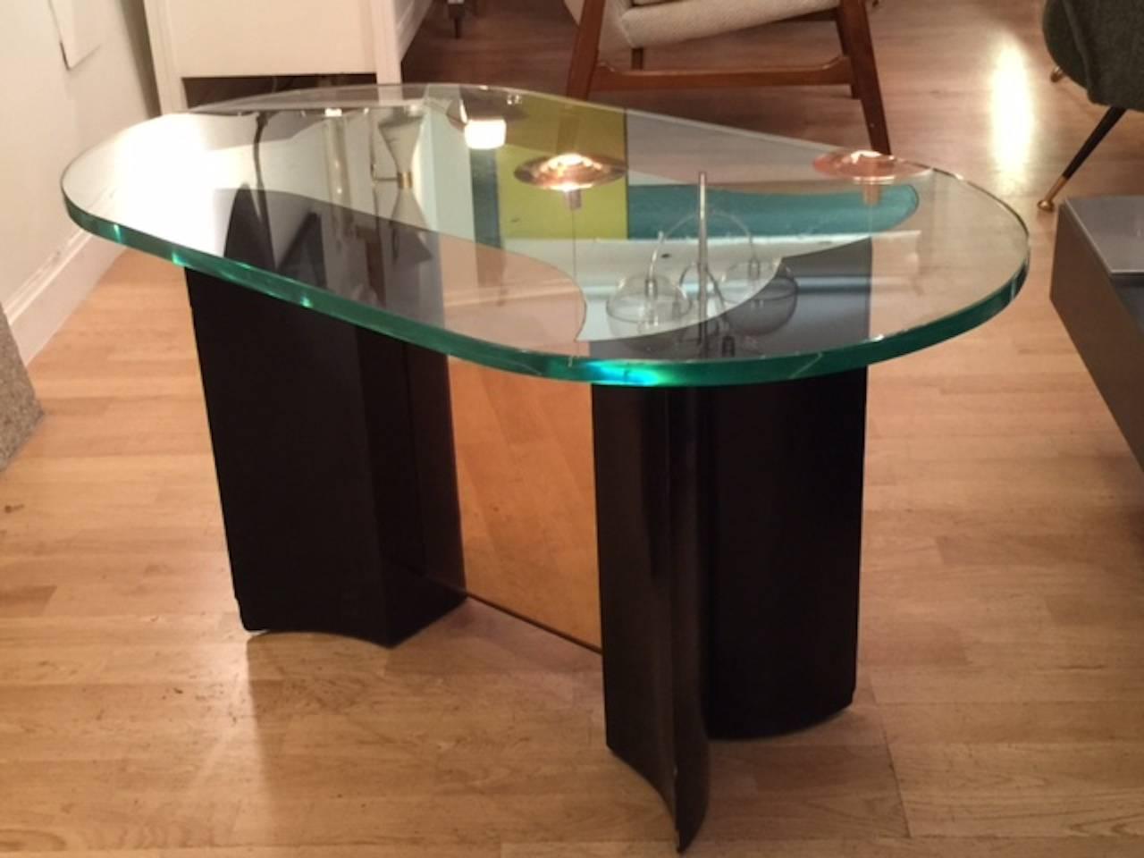 A 1940s Fontana Arte coffee table. Wood and mirror base, brass and Fontana Arte two centimeter thick glass. Beautiful patina. Exceptional design.Free professional packing