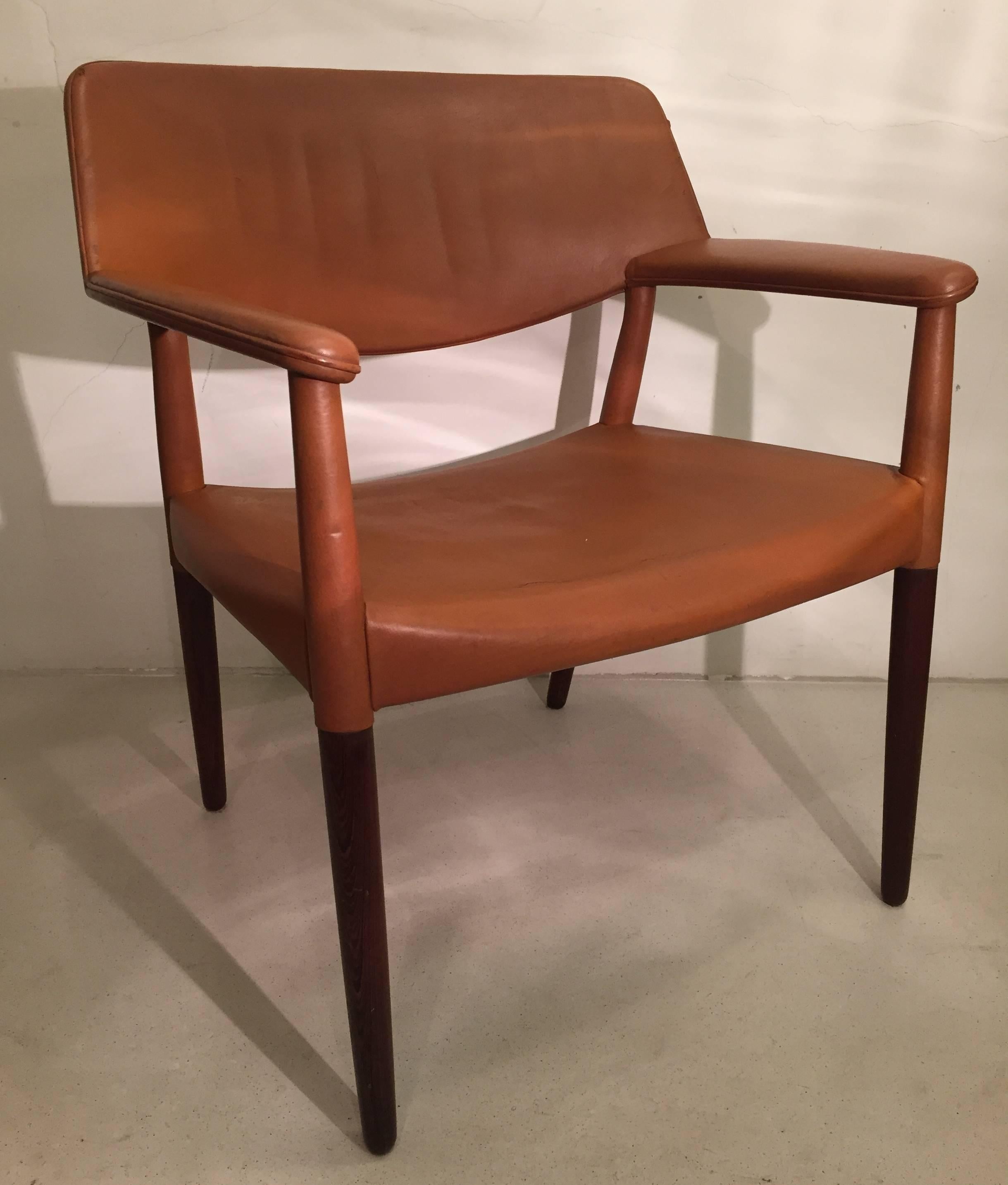 An outstanding armchair of solid wenge wood and original cognac leather designed by architects Ejner Larsen and Aksel Bender Madsen and produced in 1964 by cabinetmaker Willy Beck.