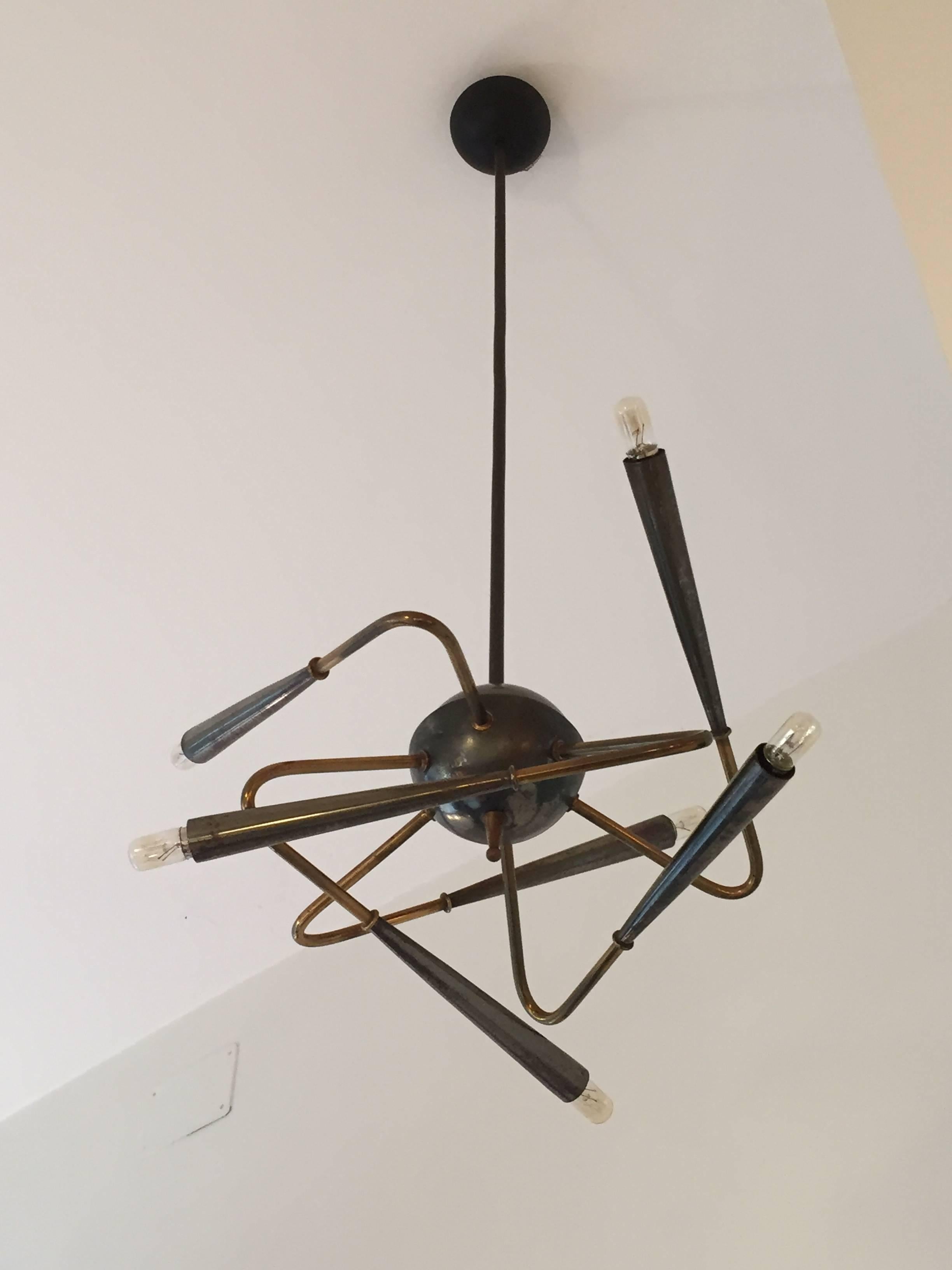 A entirely original 1950 Stilnovo chandelier. Brass and metal frame, six arms and reflectors. No reedition. Excellent condition.