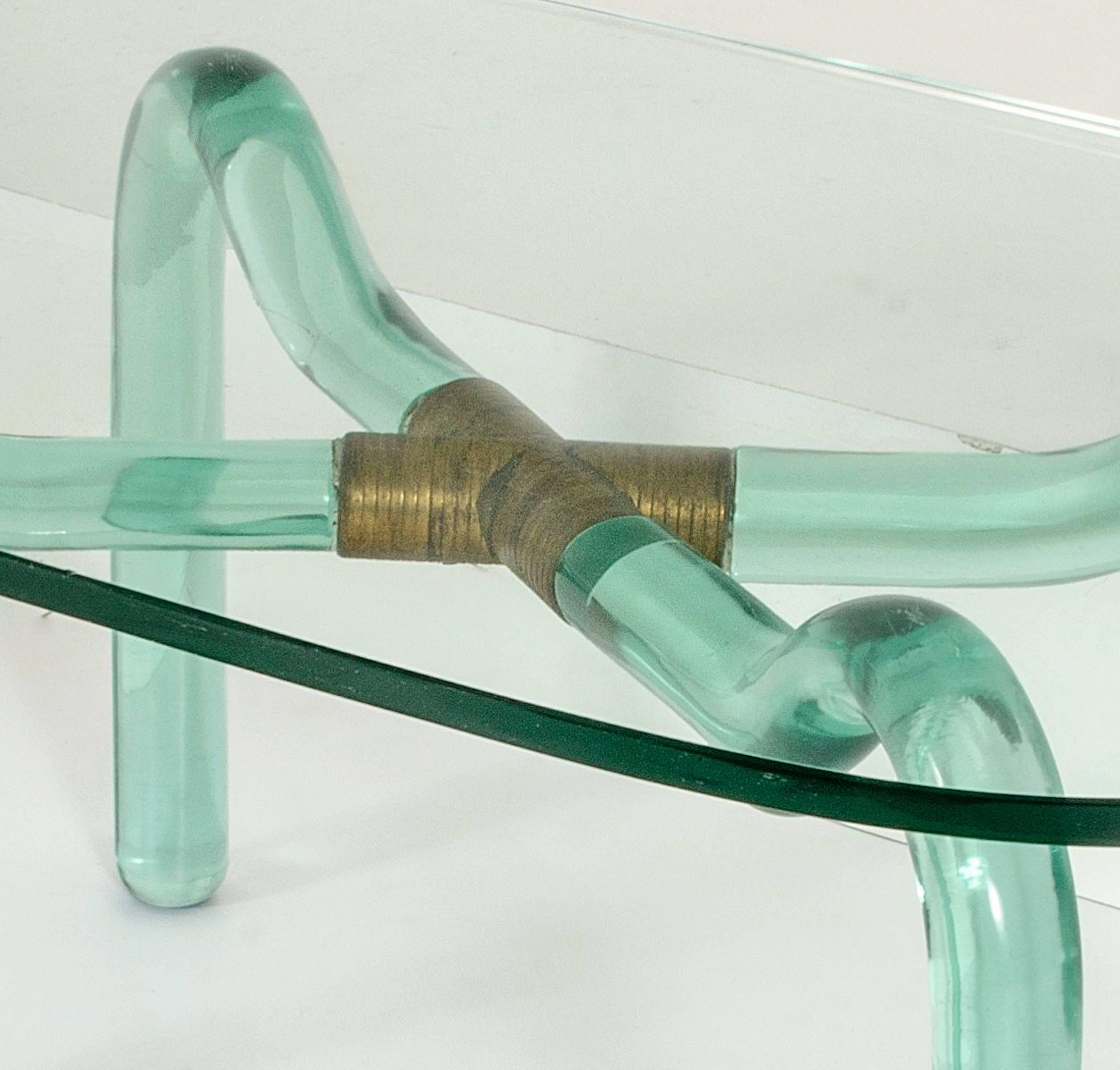 A coffee table produced by Seguso in 1950.Beautiful green cut-ground glass and brass connection.Fully original .  Excellent condition.