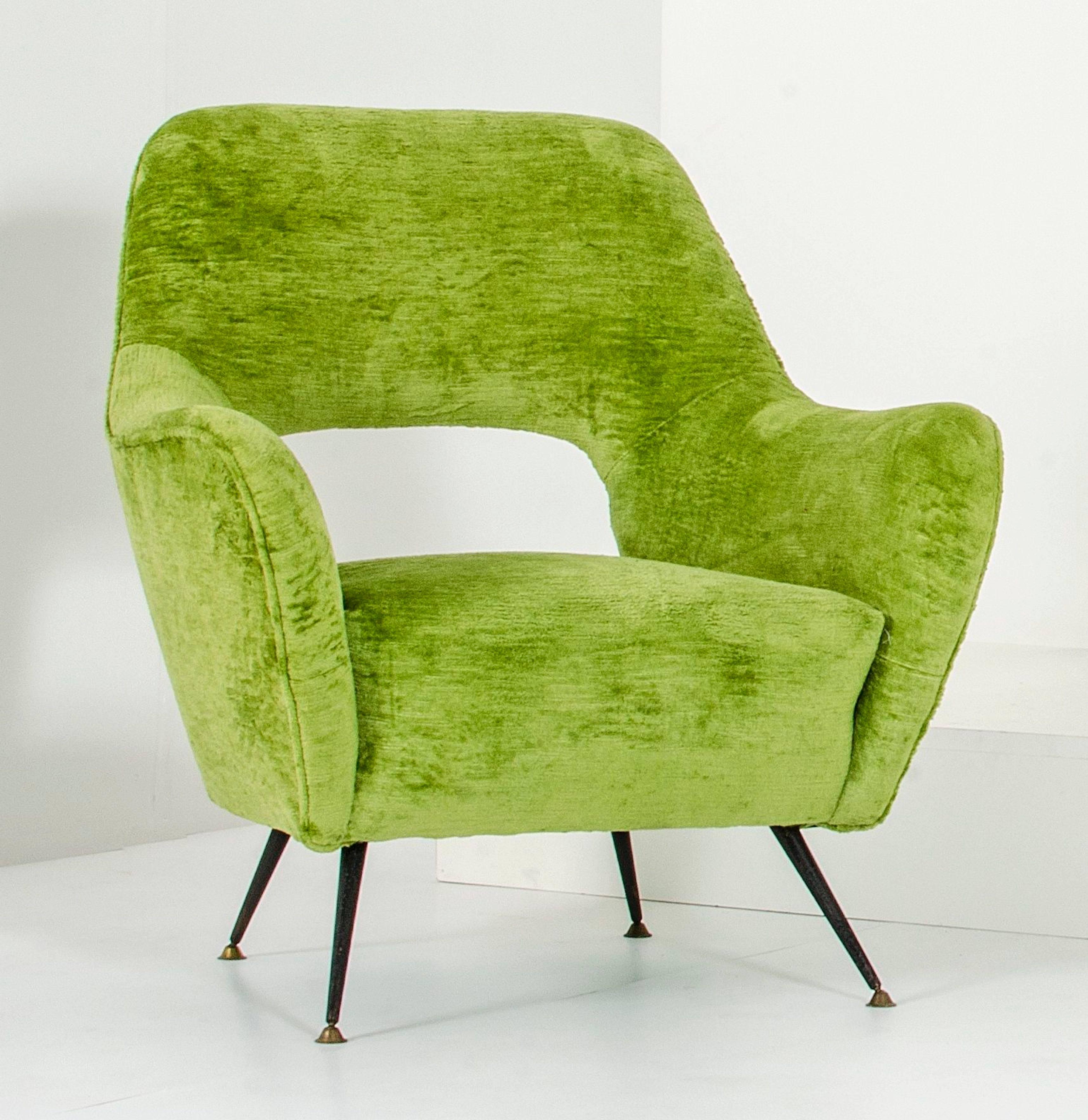 A pair of Gastone Rinaldi armchairs, upholstered in green velvet on enameled metal legs. Edited in the 1960s. Excellent condition.