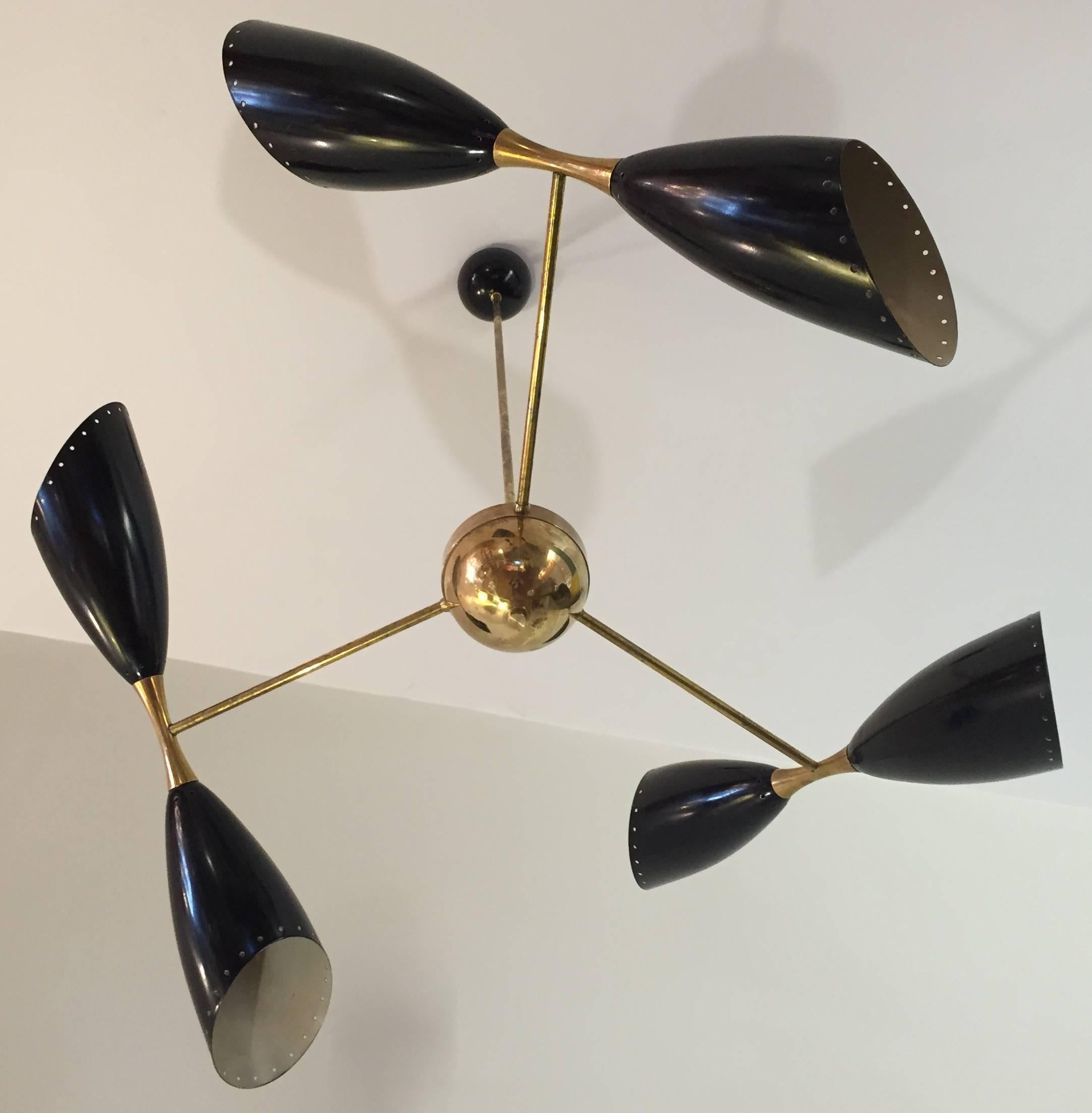 An outstanding Stilnovo style chandeliers. Three aluminum double diabolo shaped shades (60 cm) in enameled black with brass hardware and structure .Newly polished and rewired. Original condition.
Two in stock. Price is for item.