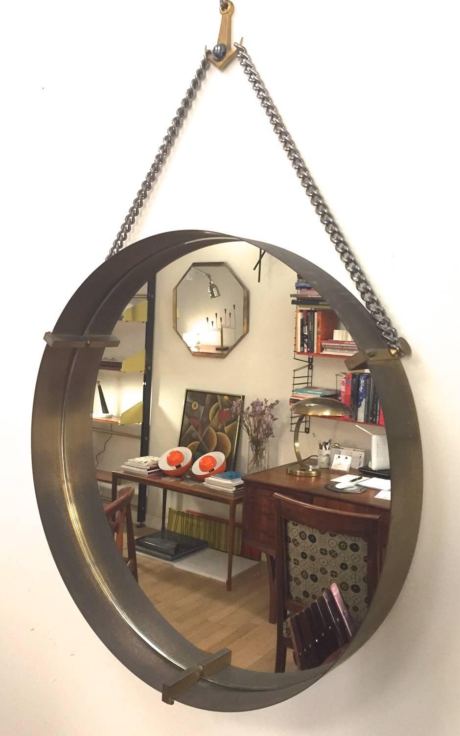 An Italian brass wall mirror. Original mirrors glass. Excellent condition.