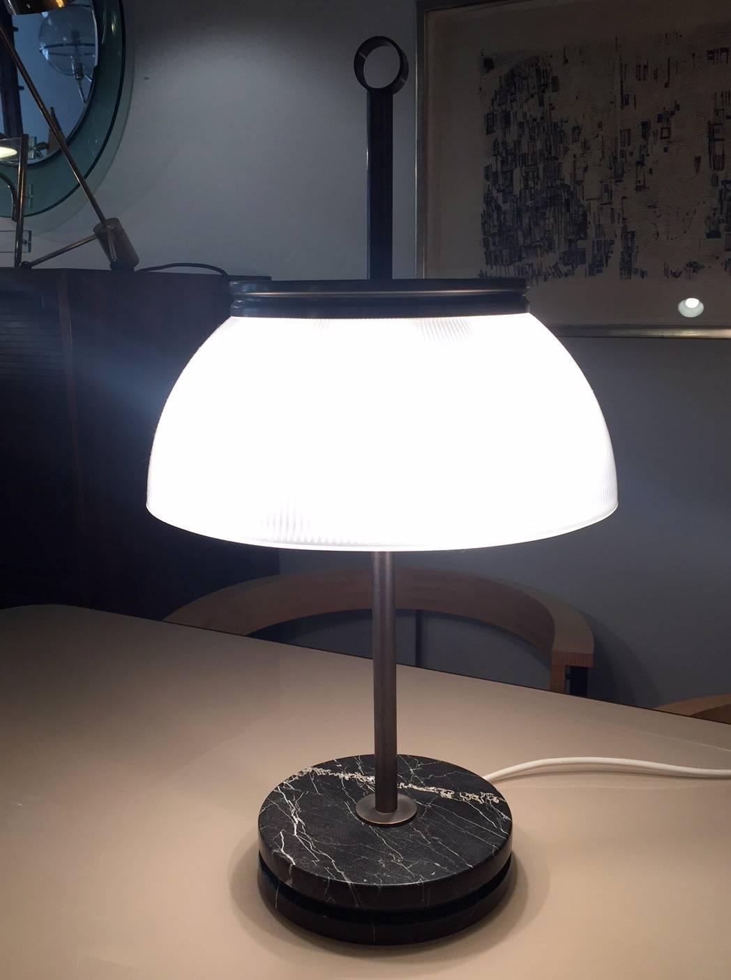 A table lamp designed by Sergio Mazza for Artemide. Marble ,nickel plated brass and printed glass.
Excellent condition.