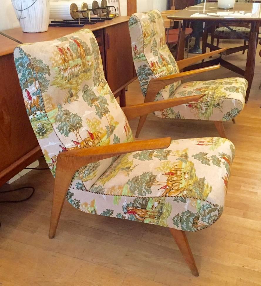An exceptional pair of Midcentury Italian armchairs. Original and impeccable fabric. Extremely comfortable. A collection set.
