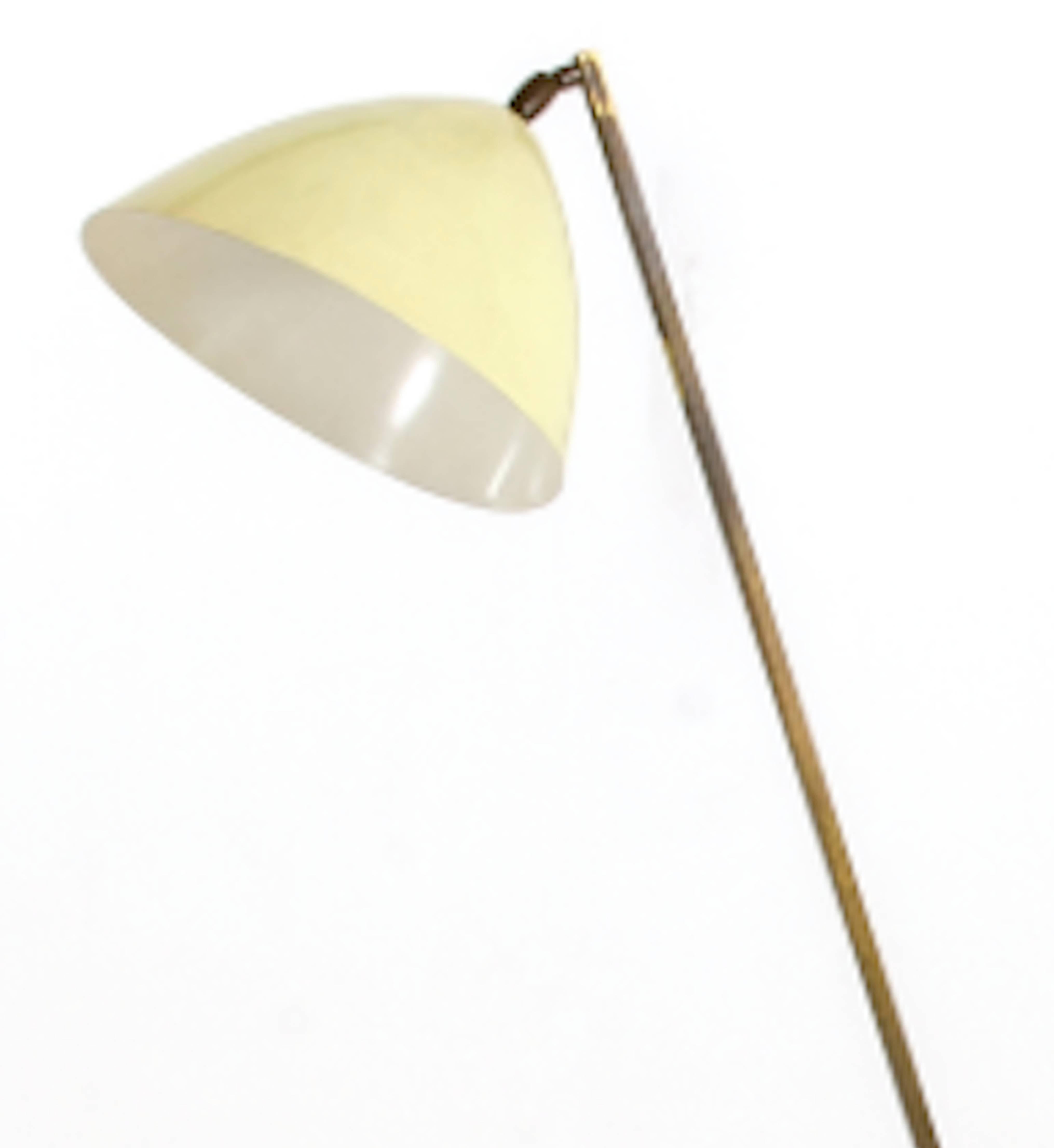 A Stilnovo metal floor lamp produce in 1950s, enameled metal shade, and brass frame and base. Excellent condition.