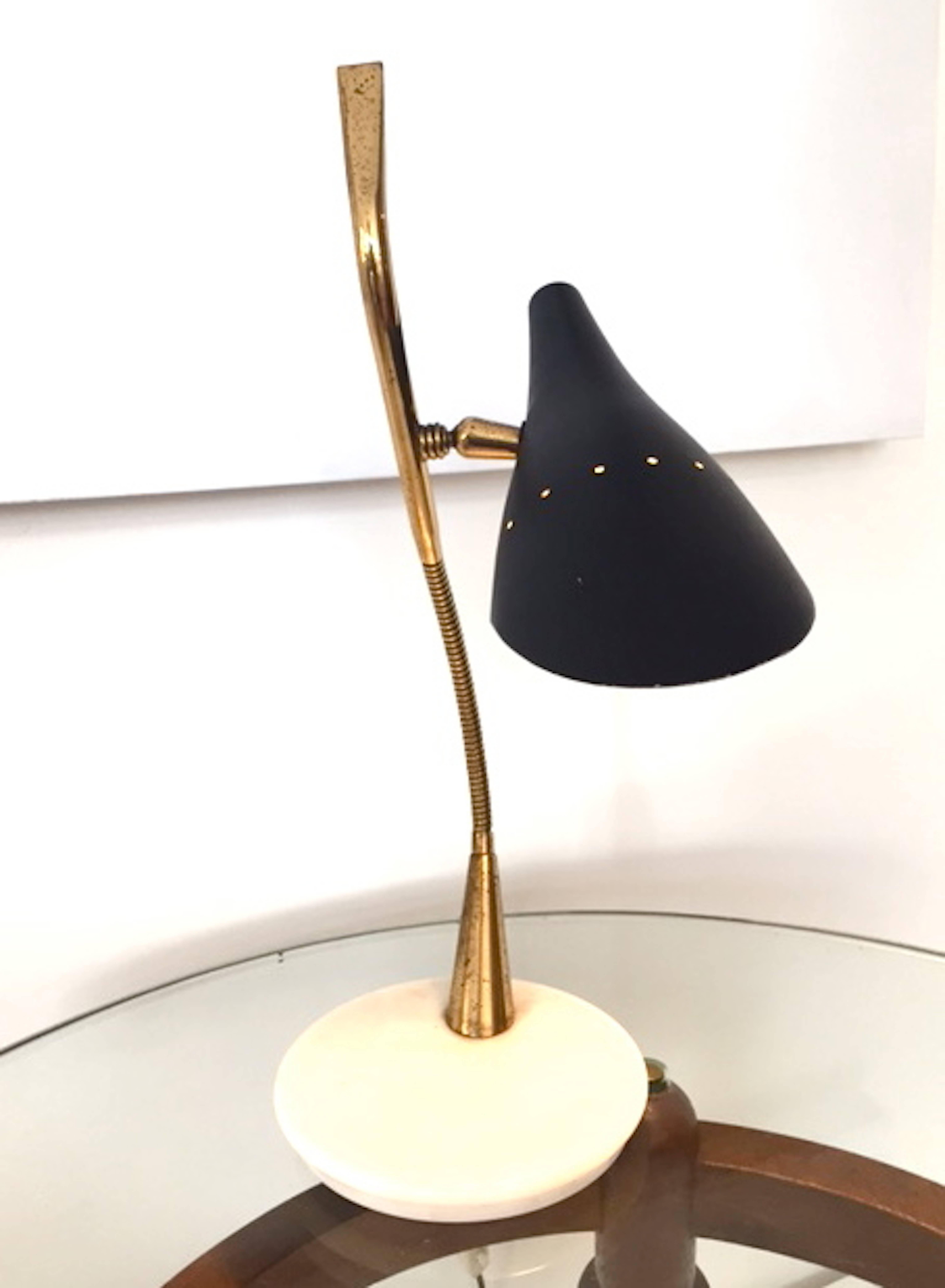 A table lamp designed by Italian designer Oscar Torlasco. Black enameled metal, brass frame and marble base. Adjustable shade.Excellent condition.Free packing and shipping is provided.