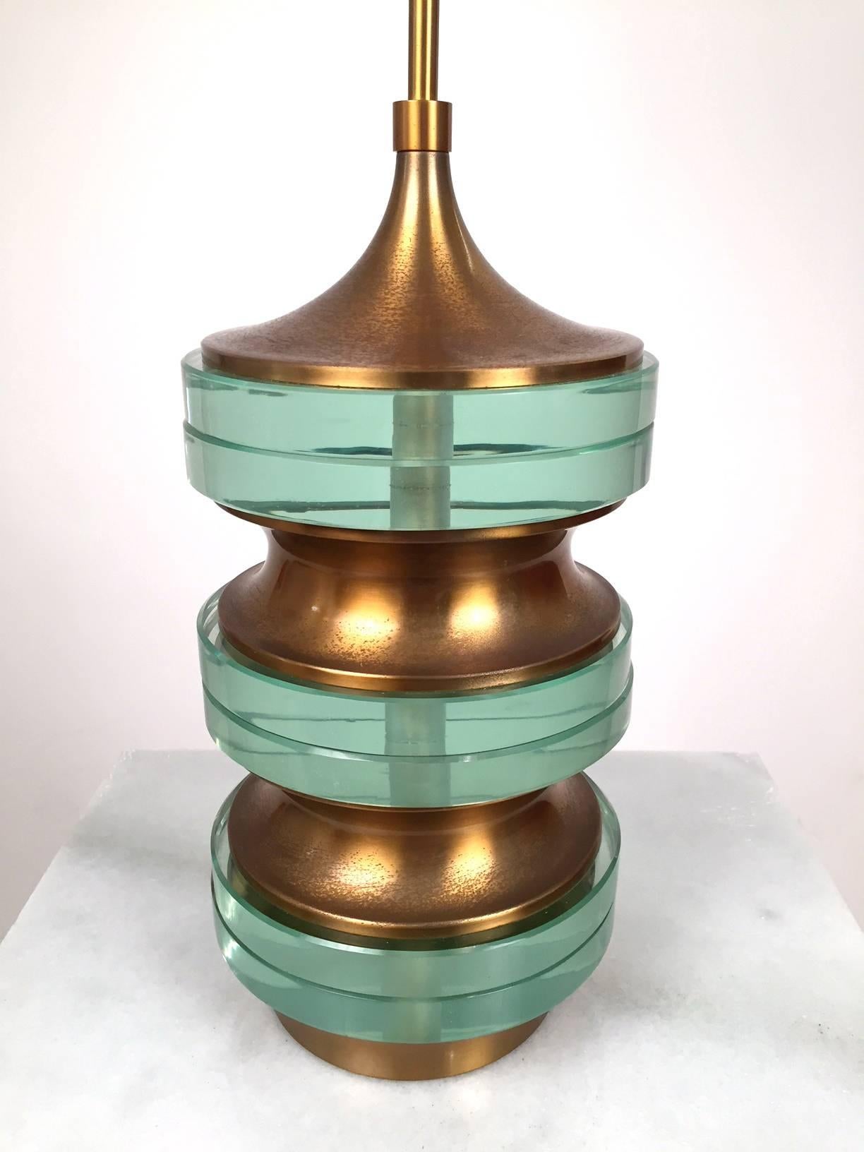 A very rare Stilnovo table lamp. Limited edition .Glass and brass base .Market 