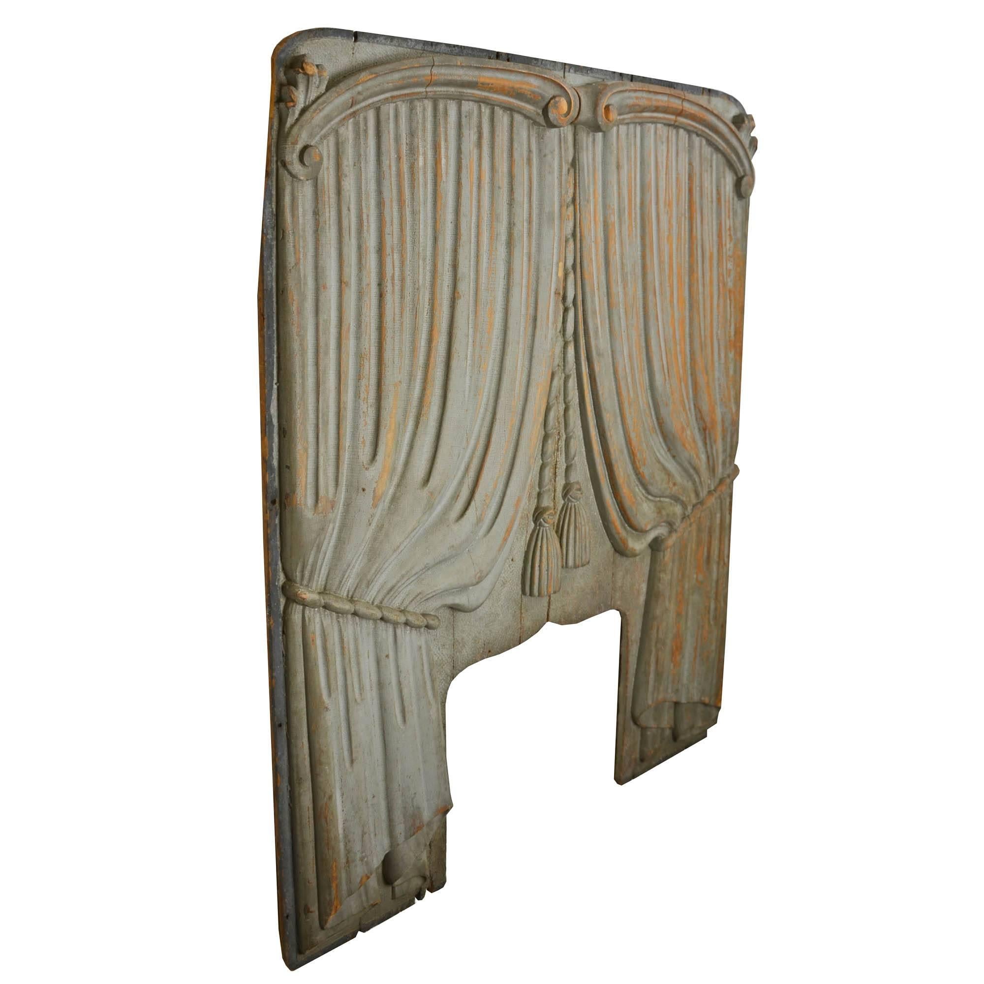 Likely salvaged from a 1920s Ford hearse, this hand-carved panel represents a unique trend in automotive history. Originally, horse-drawn funeral carriages were adorned with silk or velvet hangings, but, over time, the curtains were replaced with