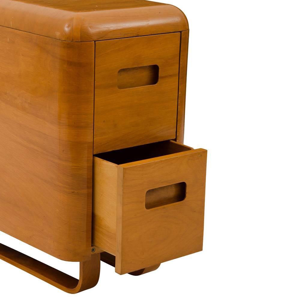 Designed by Paul Goldman for Plycraft in 1946, this incredible molded birch-veneered cabinet was part of the Plymodern line. Like Charles and Ray Eames, Saarinen and Panton, Goldman pioneered the molded plywood industry - in fact, he is considered