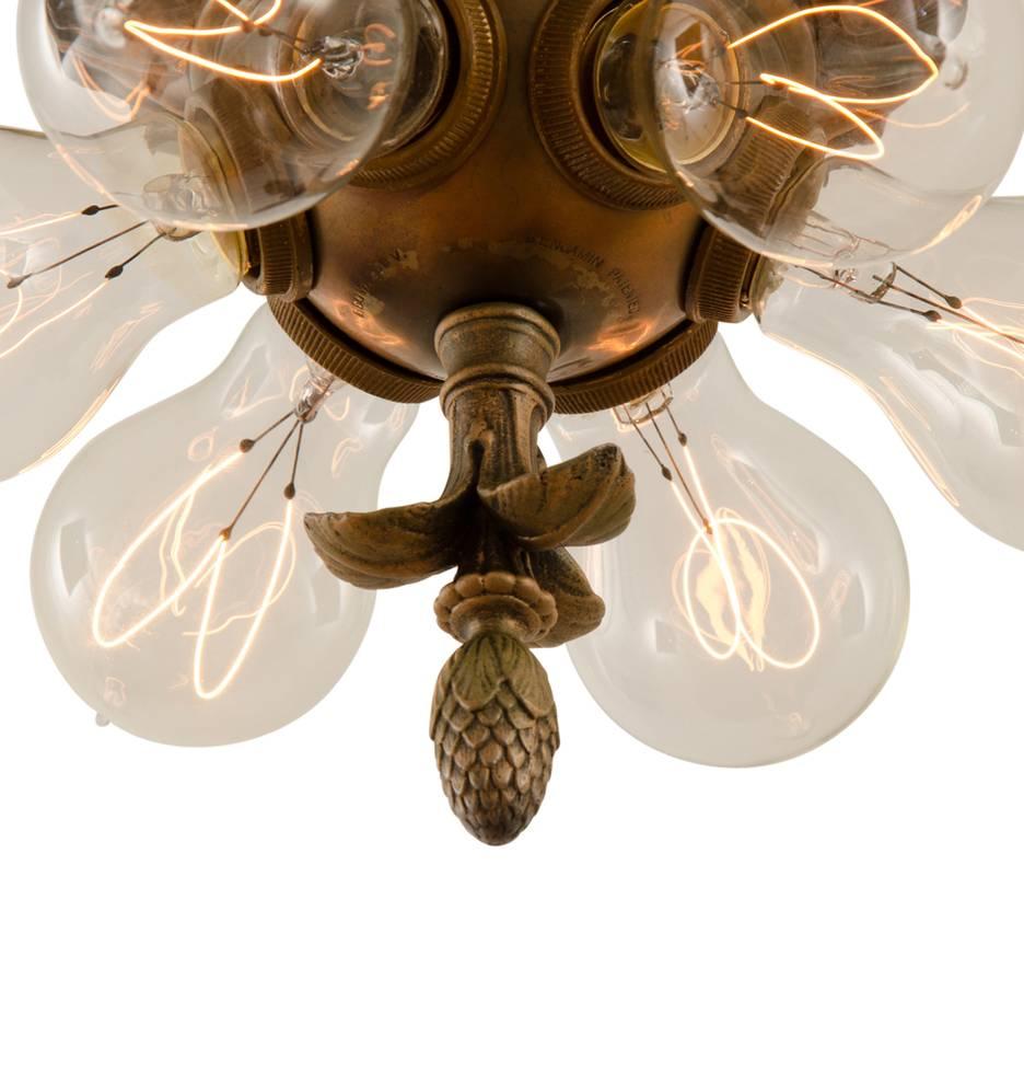 Exposed bulbs were widely popular lighting choices during the 1910s and 1920s, and so was a free exploration of Classical Revival motifs. That style teamed for a high-end, yet traditional look, which was well-suited for the countless houses built