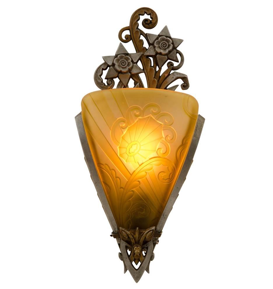 Unique pierced design, with incredible Art Deco motifs -- stylized flowers, scrolls and angles. All carried through in the amber glass slipper shade. 

Following the dazzling worldwide success of the 1925 International Exhibition of Modern