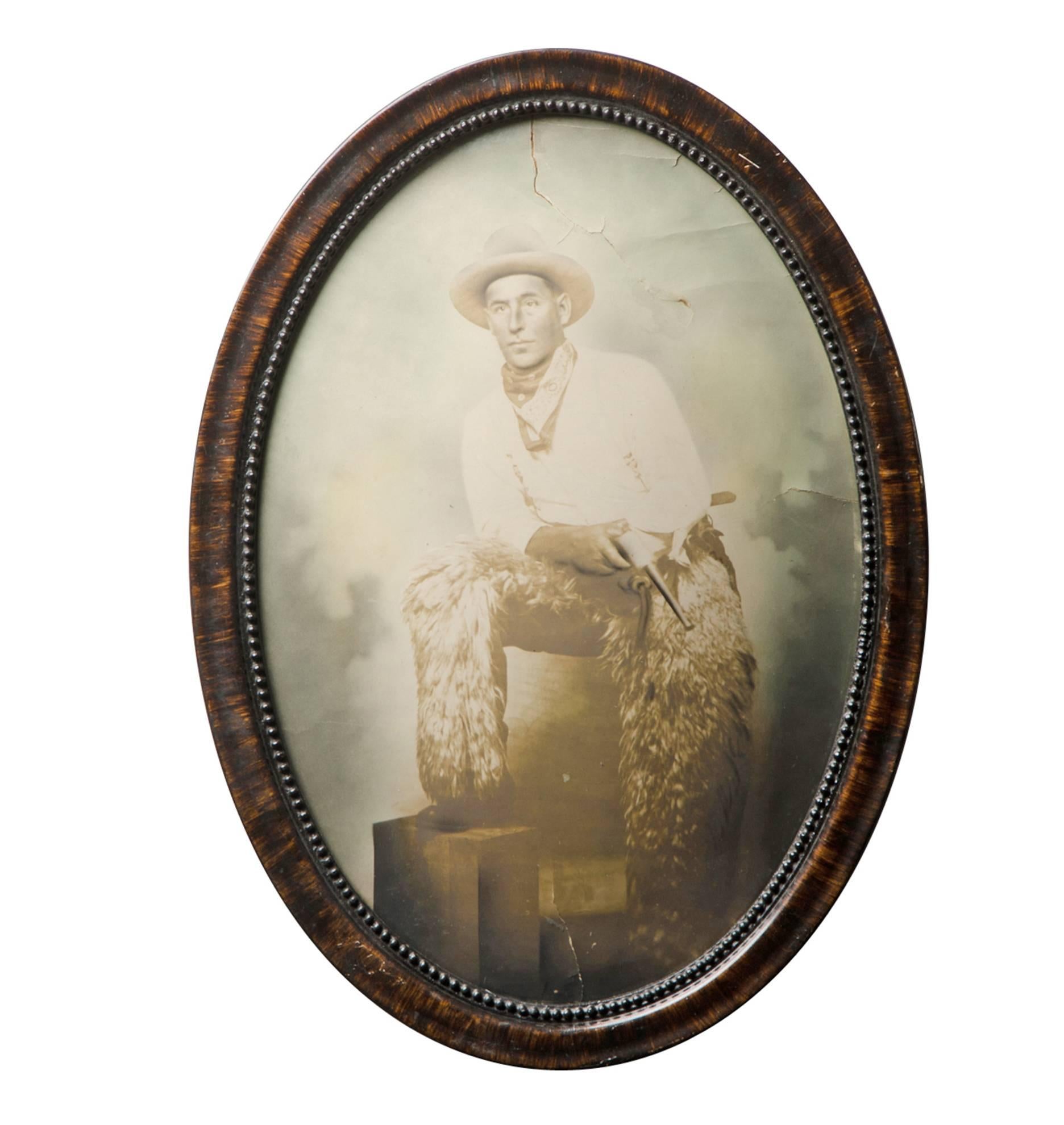 Hand-Tinted Cowboy Portrait in Convex Frame, circa 1920s For Sale