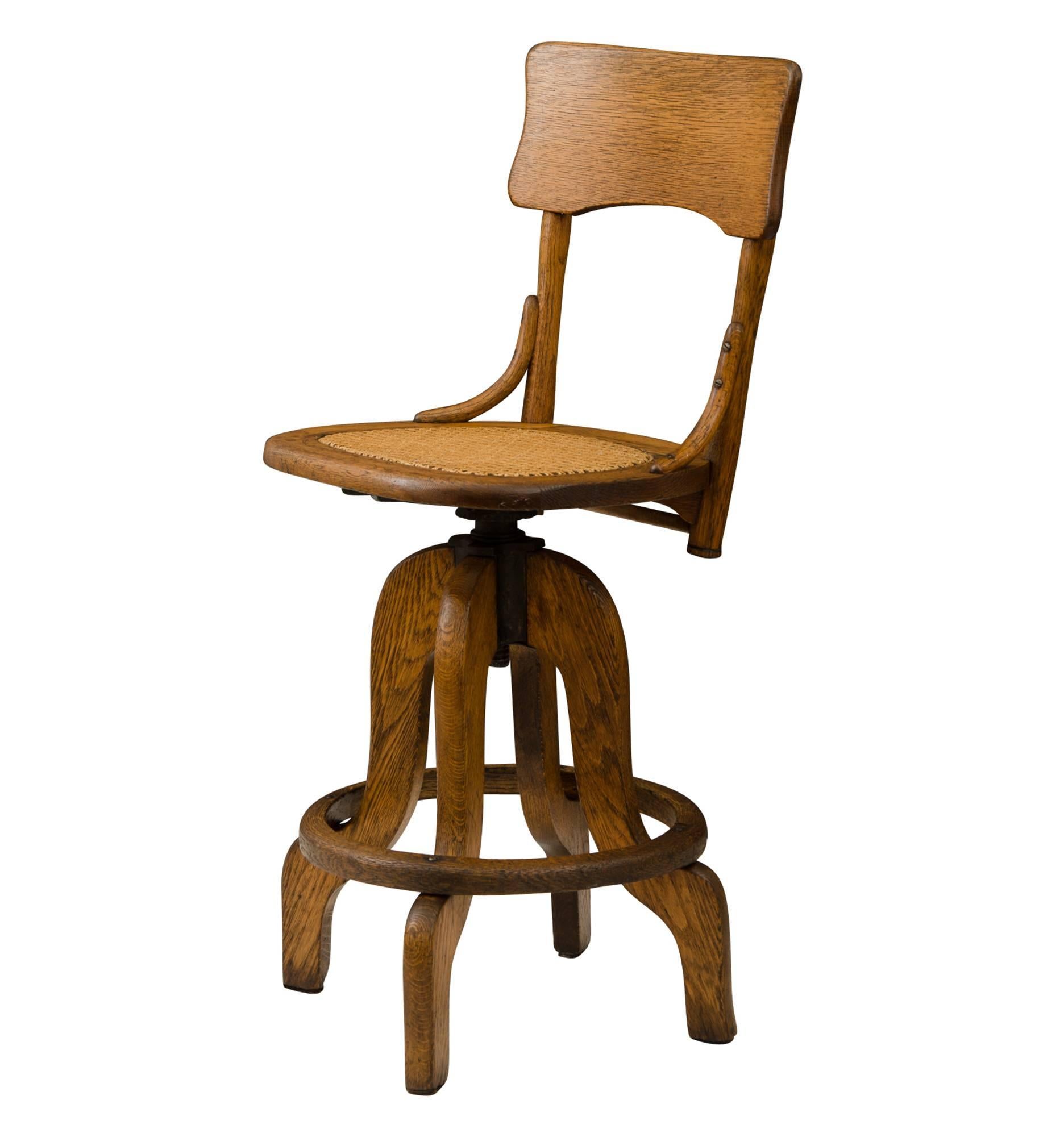 Oak Operators Stool with Caned Seat, circa 1925 For Sale