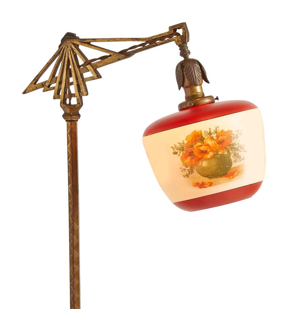 In the realm of antique bridge lamps, this specimen has it all: a wonderfully ornate cast body with plenty of Art Deco character and original brass-finished highlights, and a delightfully painted and decalled shade. The shade, thanks to its cast
