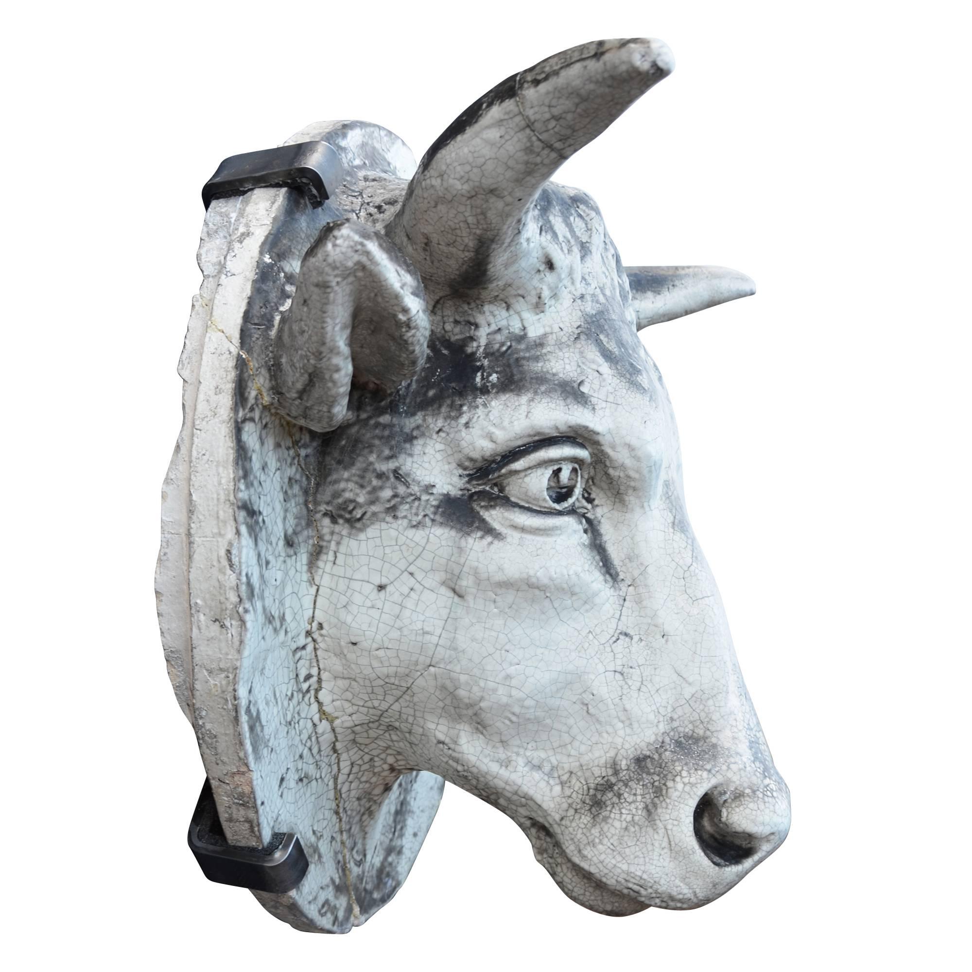 Salvaged from the front of a meat packing plant in Buffalo, NY, this astonishing bull's head is an incredible relic from the heyday of agricultural-Industrial dominance. Weighing nearly 80 pounds, the terra cotta proves to be a very durable, yet