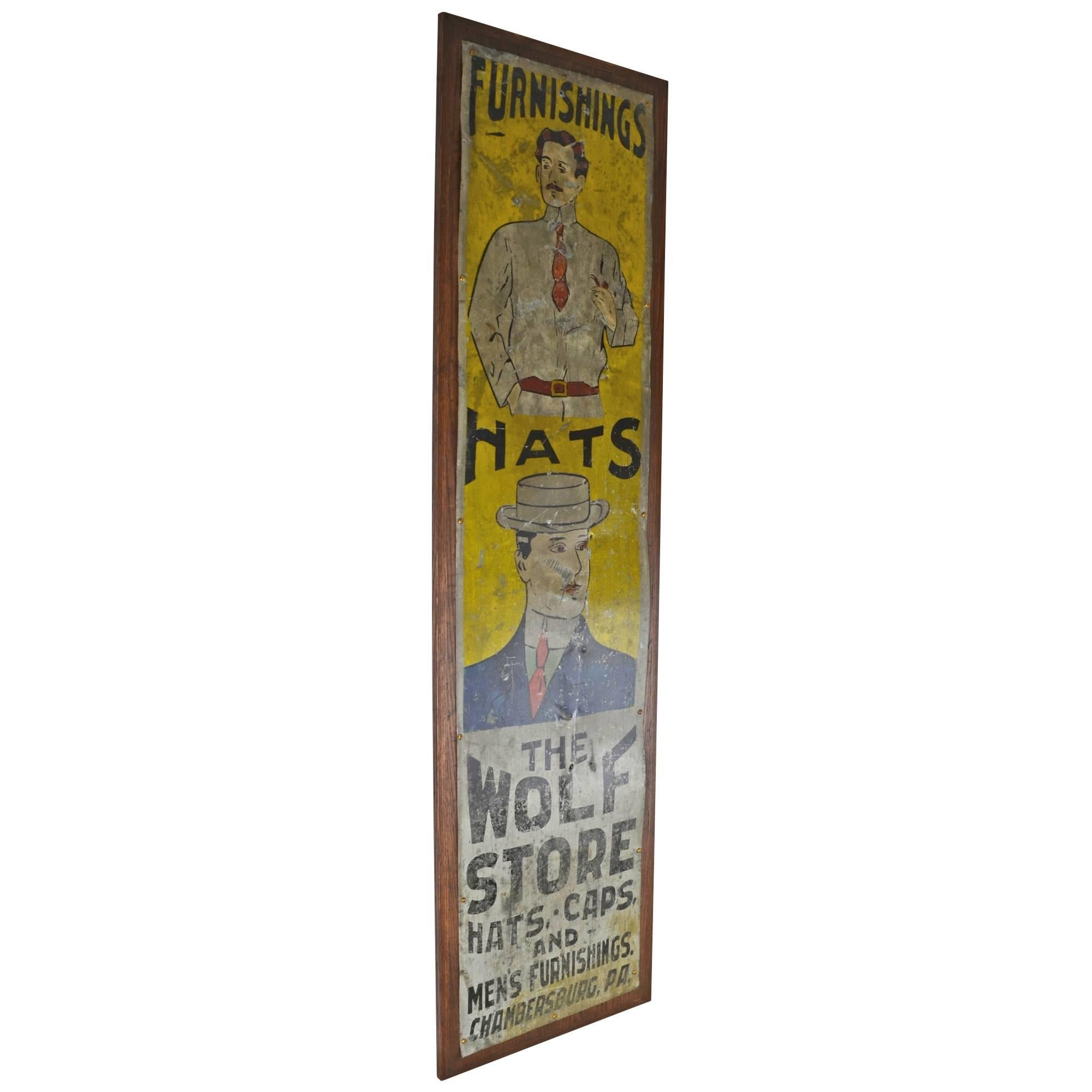 What could be more dapper? This hand-painted sign features gentlemen of the period (early 20th century) sporting the finest styles of the day: high, starched collars, straw hats and smartly-cropped mustaches and hair cuts. While the Wolf Store is