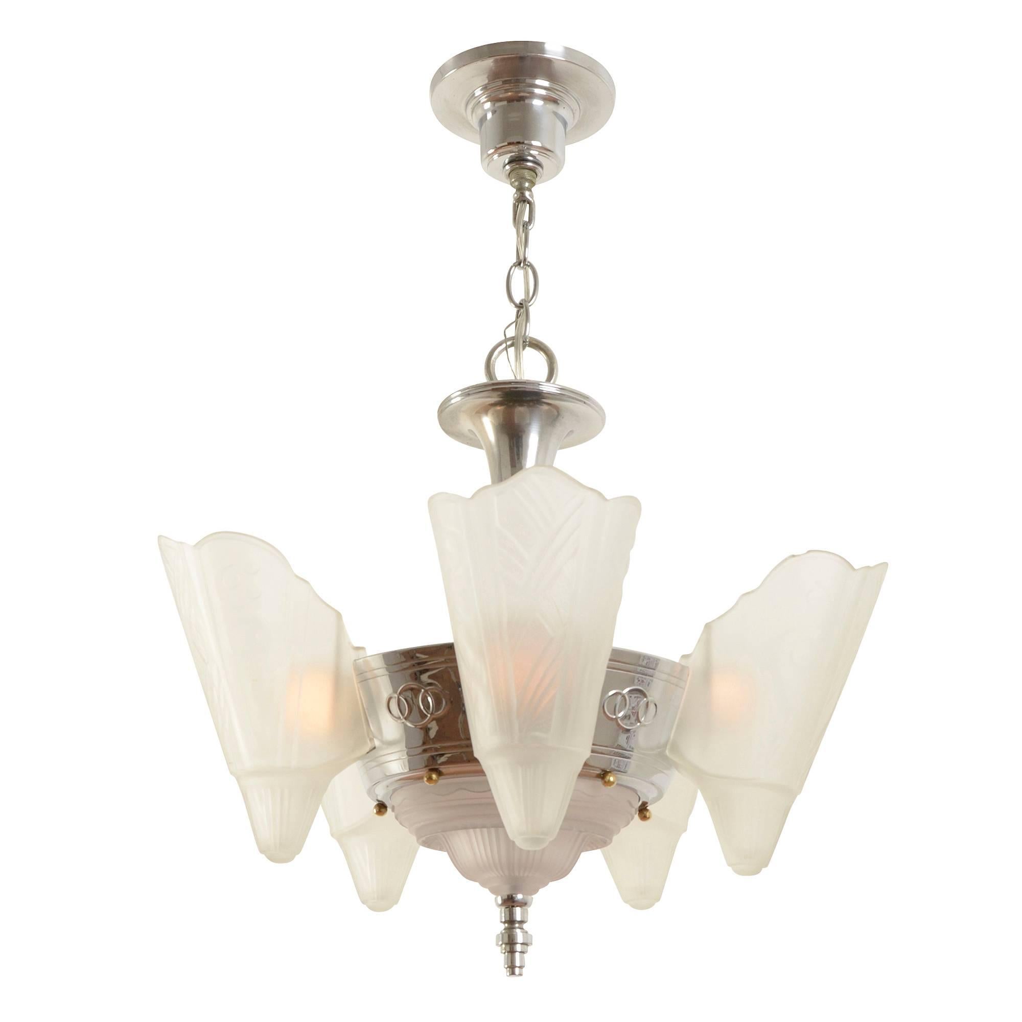 Produced by the Globe Lighting Fixture Manufacturing Co. of Brooklyn, New York, this stunning slipper shade chandelier features one of Globe's most beautiful and hard-to-find shade patterns, combined with their signature 