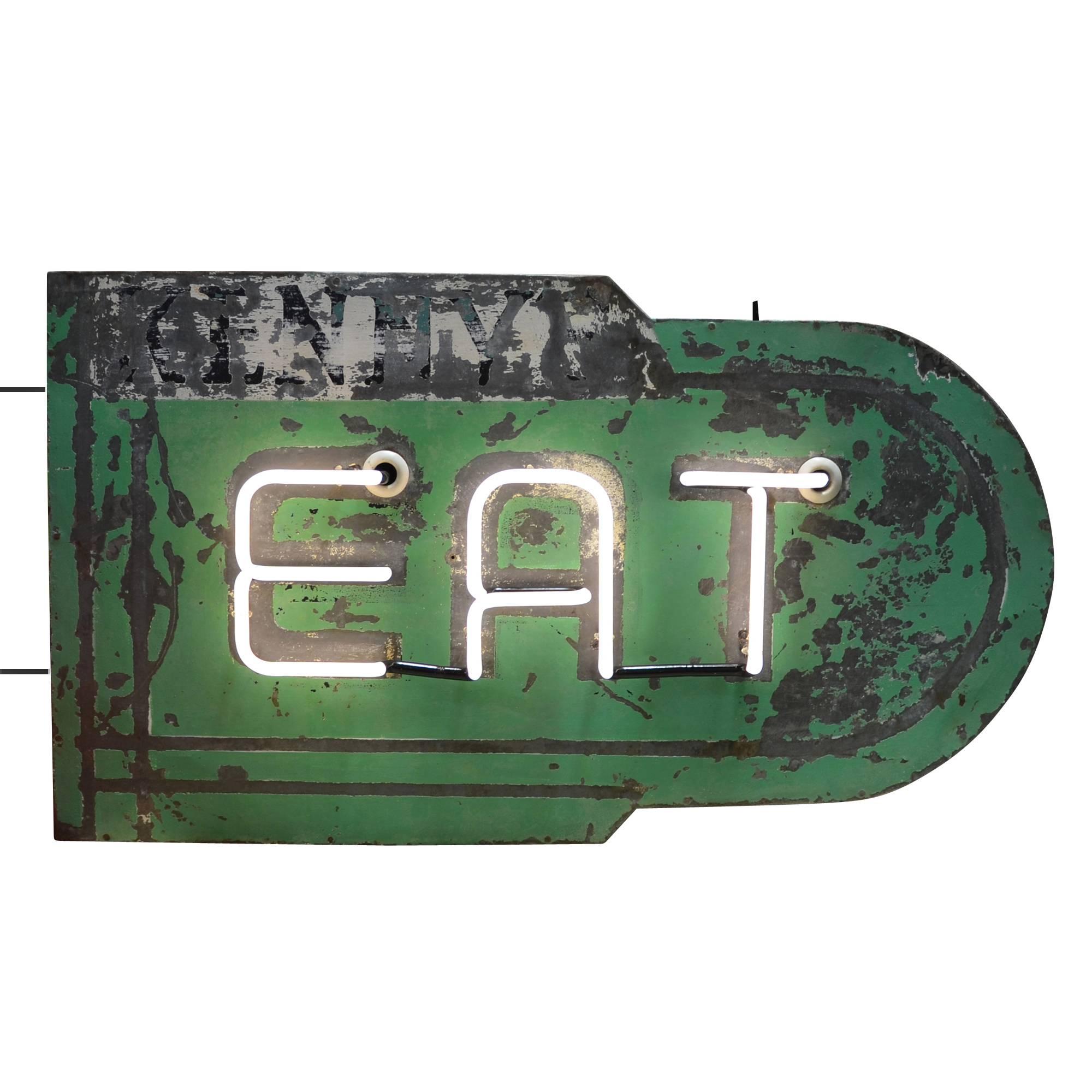 Once in a blue moon we come across a neon sign with unique, streamline character and we get very excited. This holy grail of vintage signs proudly advertises EAT for the no-nonsense blue-collar joe, instantly evoking an entire vanished era in that