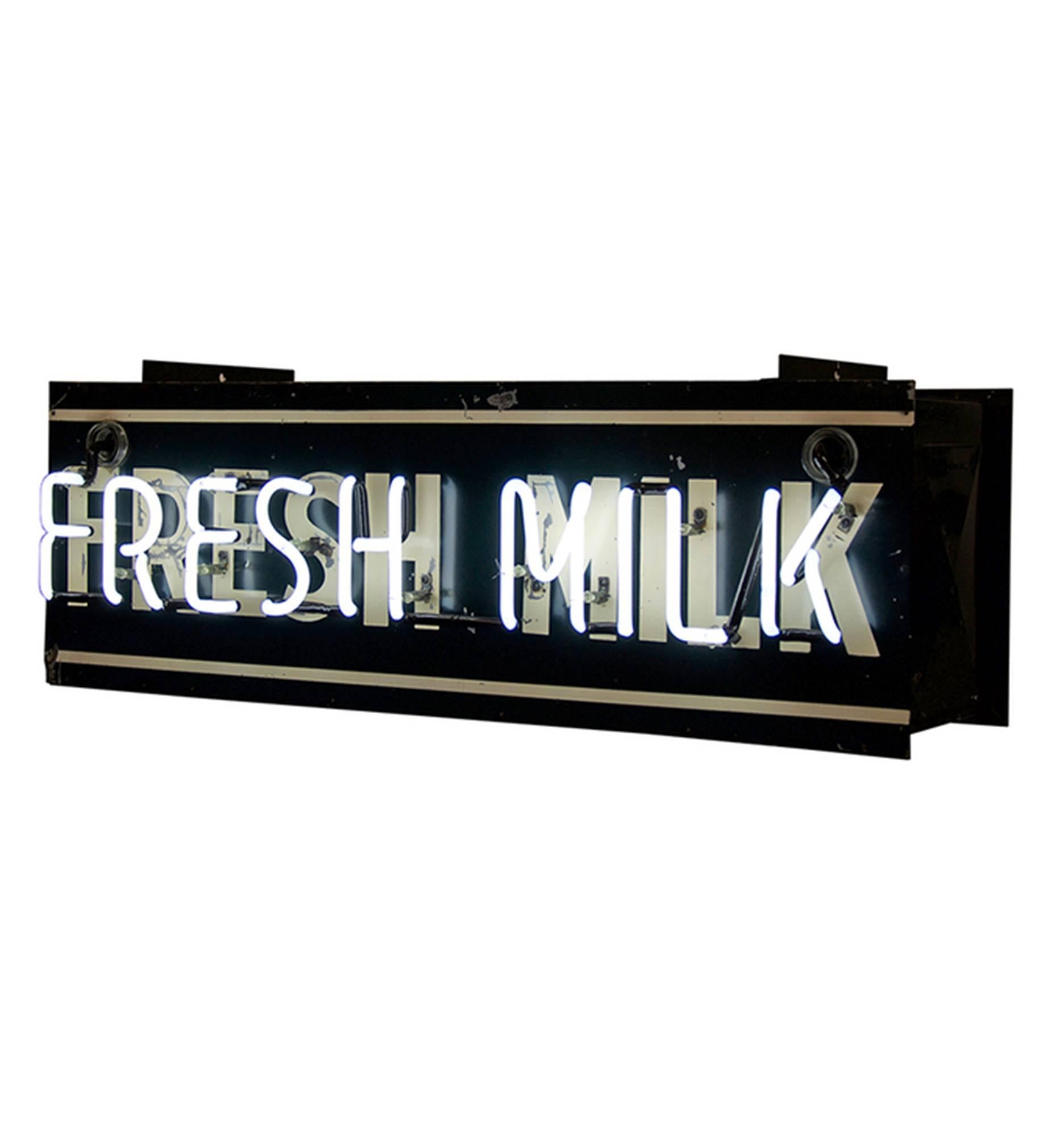 Straight from a Mid-Century general store or food mart comes this incredible double-sided Fresh milk neon sign. We love the well-preserved green and white finish of the sign canister, worn away here and there to show the metal below. The steel