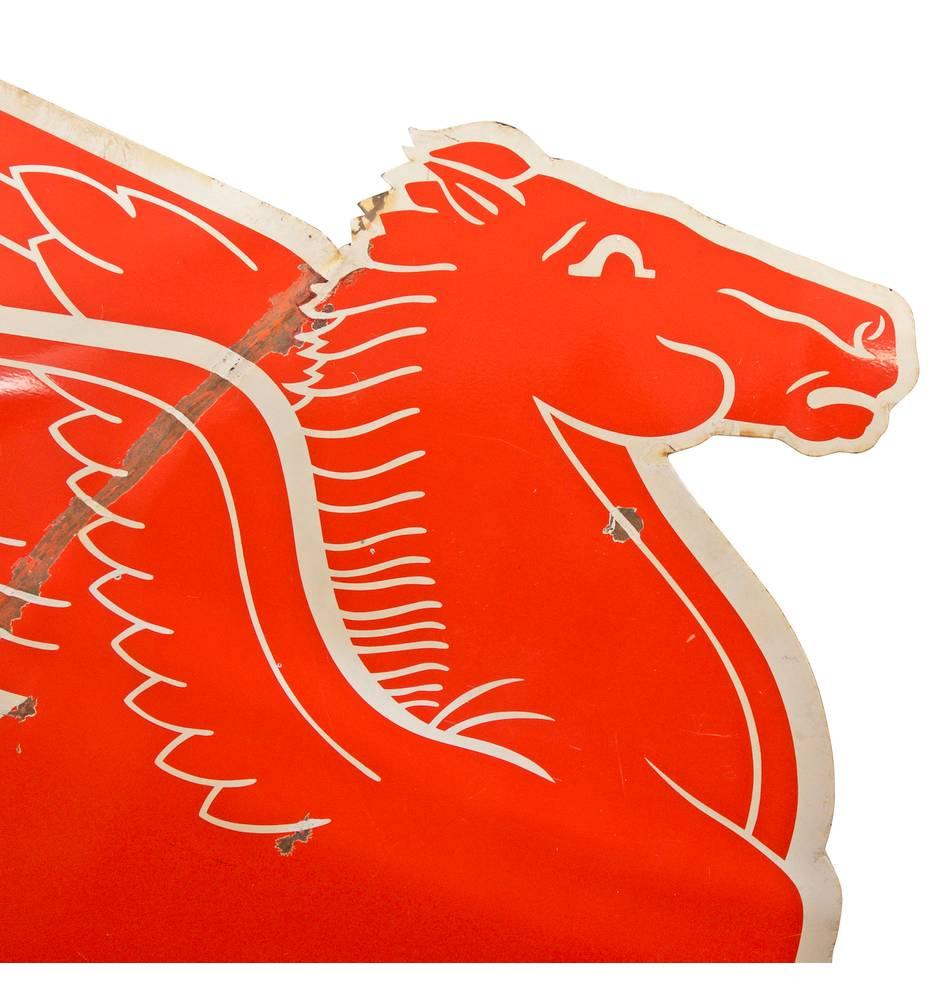 As one of the most iconic and recognizable company emblems in United States history, the Mobil Gas Pegasus has served as the guardian to many American roadways and rest stops. This astonishing porcelain sign dates from 1954 when Mobil signs were