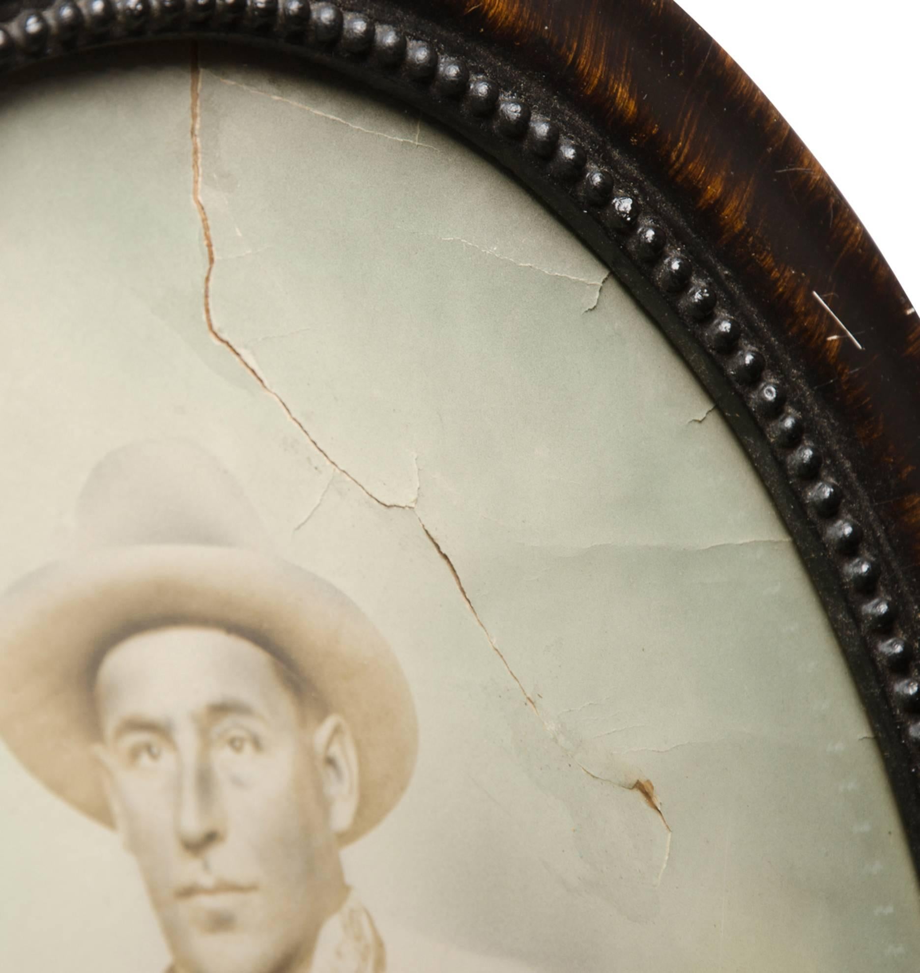 Hand-Tinted Cowboy Portrait in Convex Frame, circa 1920s In Good Condition For Sale In Portland, OR