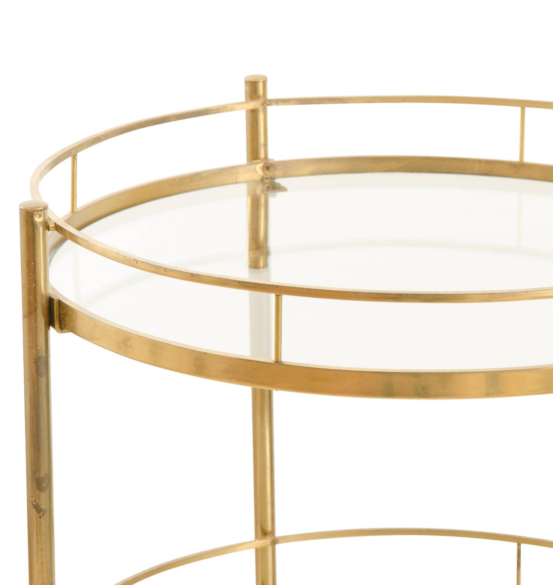 Classically Mid-Century with the period-favorite brass-toned finish, delicate composition and symmetrical styling. The three levels make this otherwise space-conscious bar cart a helpful piece.