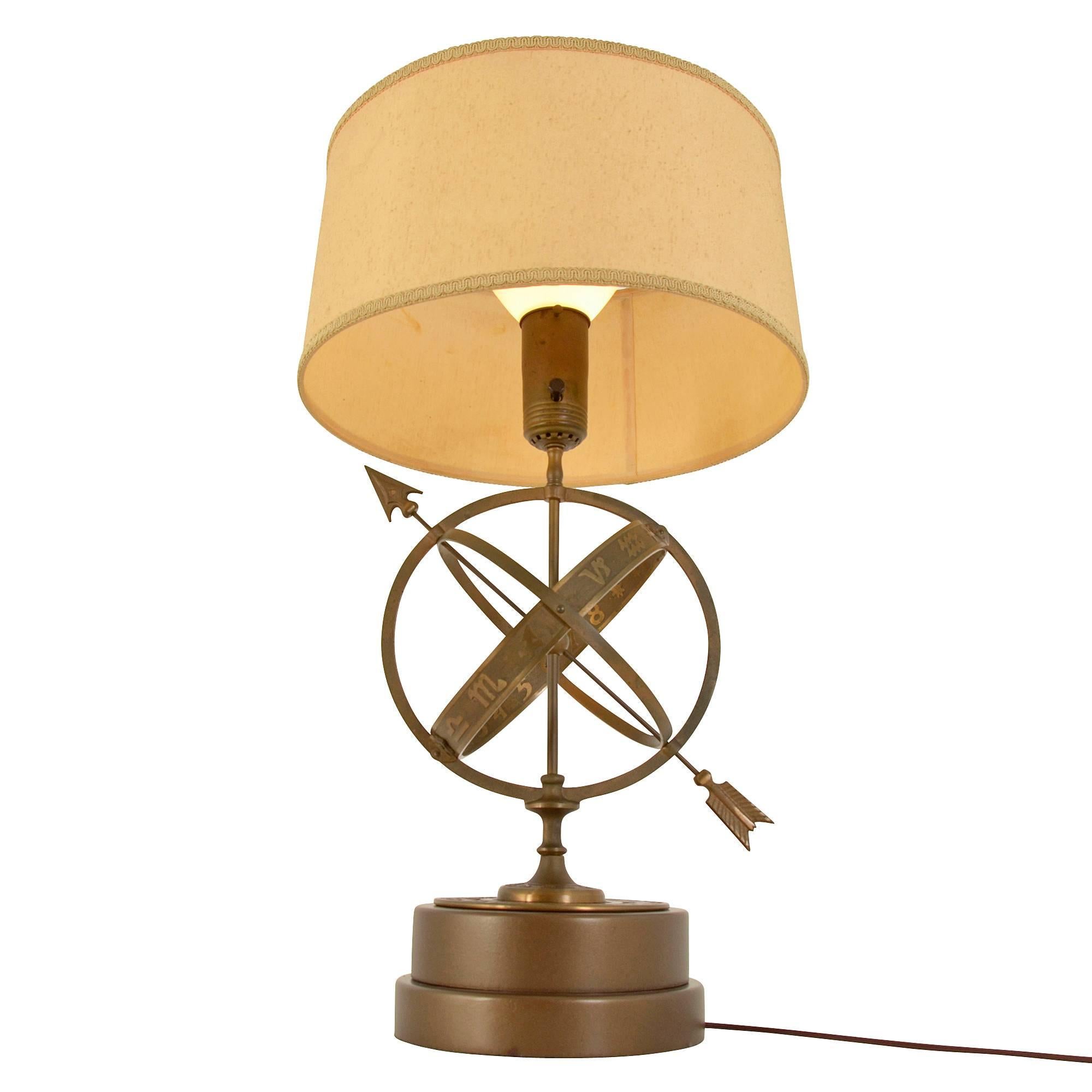 Possibly a creation of the Rembrandt Lamp Company of Baltimore, Maryland, this impressive and heavily bronze cast table lamp features a three-layered armillary. The central loop shows Roman symbols of the zodiac on the outside and numbers on the