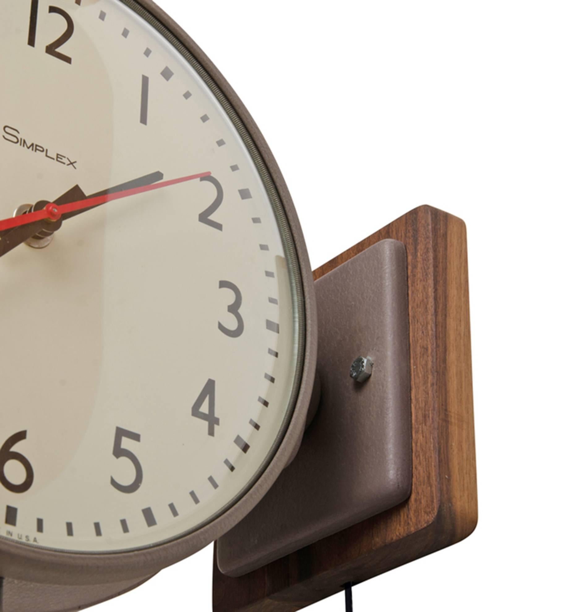 This incredible simplex clock was likely salvaged from a school or factory setting. With Classic Mid-Century styling, each face is over 14