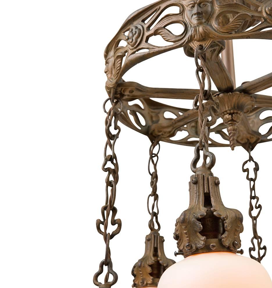 Early 20th Century Cast Iron Figural Art Nouveau Chandelier with Art Glass Shades, circa 1900 For Sale